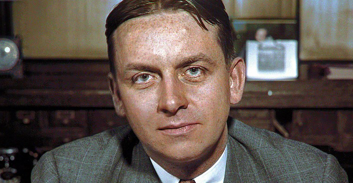 American FBI agent Eliot Ness (1903 - 1957), who headed the investigation of Chicago mobster Al Capone, sits behind his desk, 1930s.