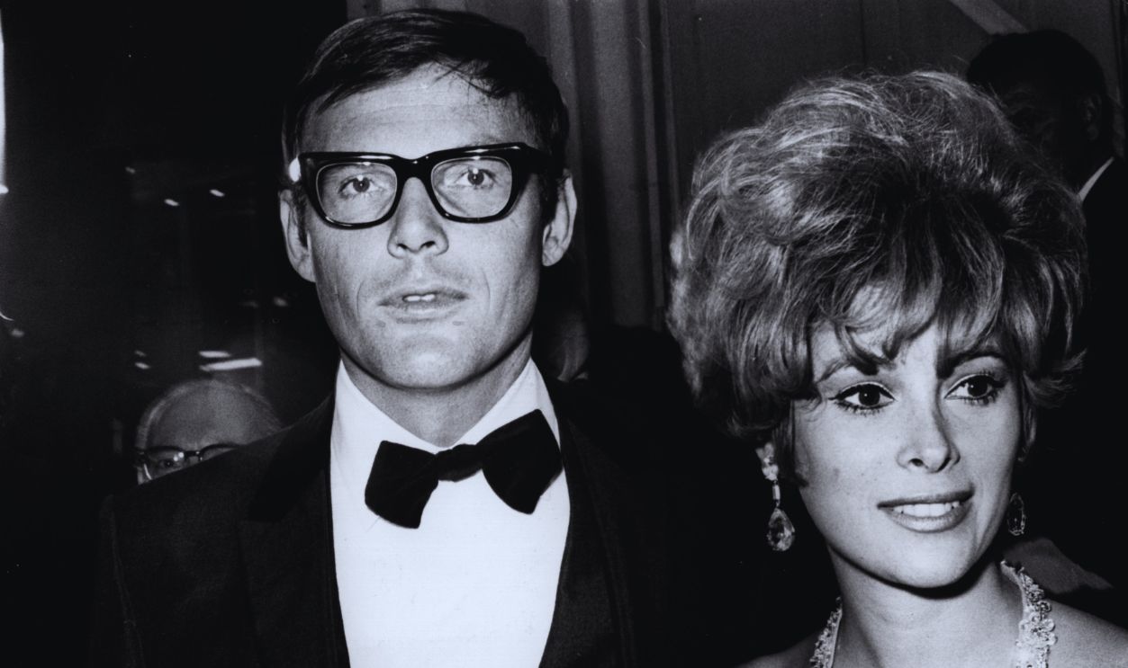 Gettyimages - 3317164, Batman October 1966: American actor Adam West with the actress Jill St John at the premiere of director John Huston's film, 'The Bible'. 