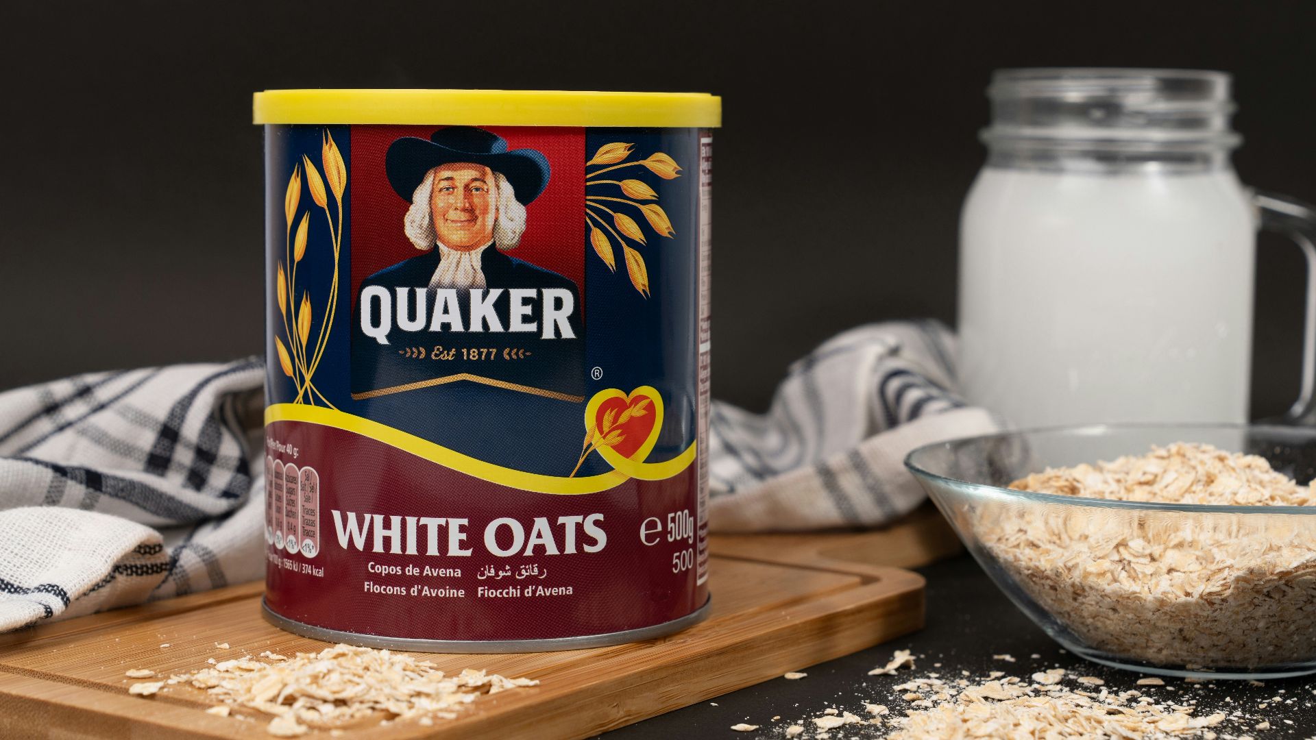 A can of oats next to a bowl of oats