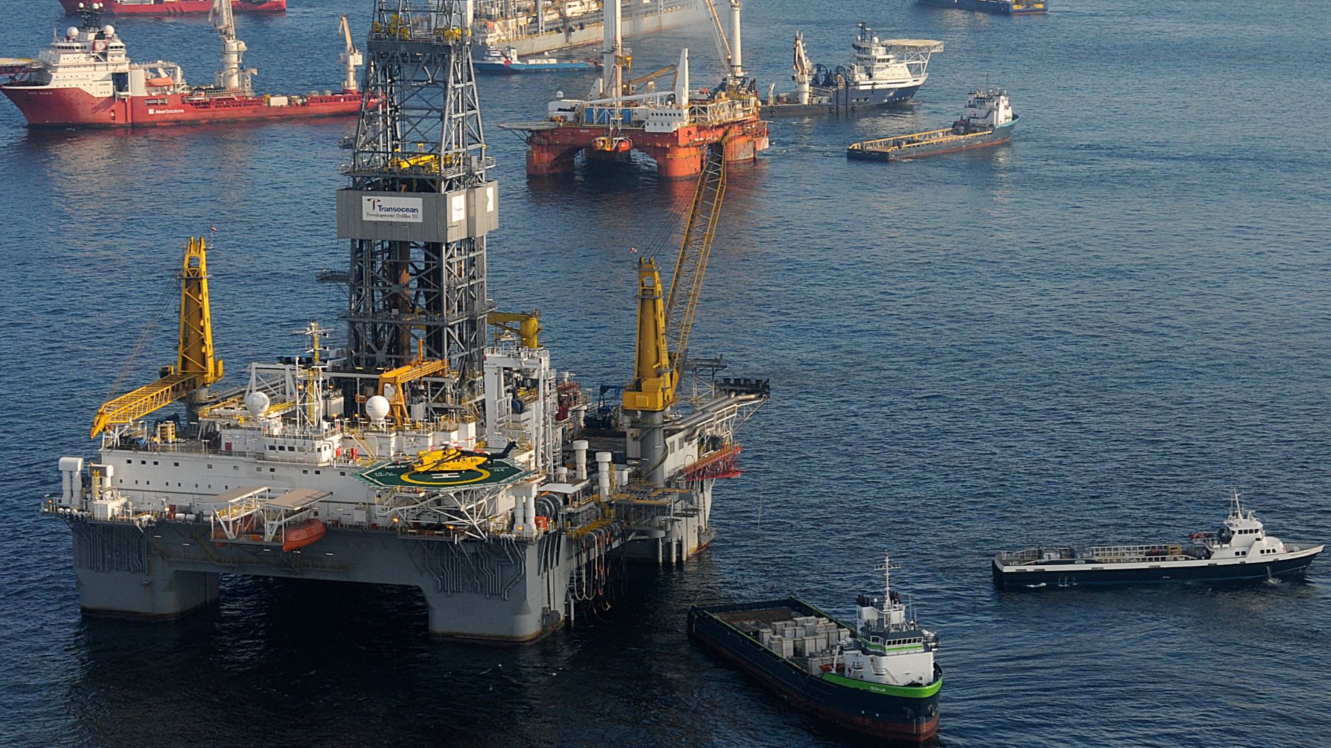 The mobile offshore drilling unit Development Driller III (near) is prepared to drill a relief well at the Deepwater Horizon site May 18, 2010, as the MODU Q4000 holds position directly over the damaged blowout preventer. While the drillship Discover Ente