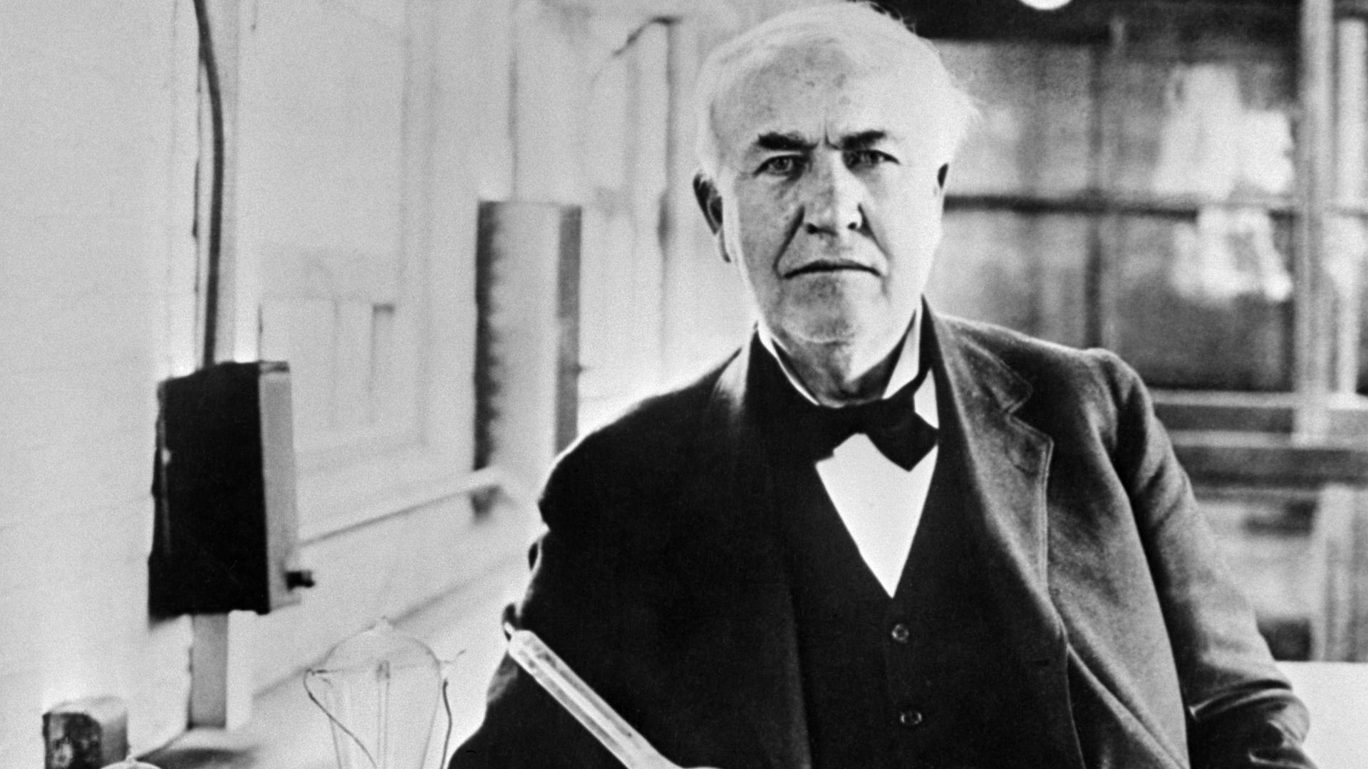 Thomas Edison (1847–1931)  with his invented white light bulbs from 1883.
