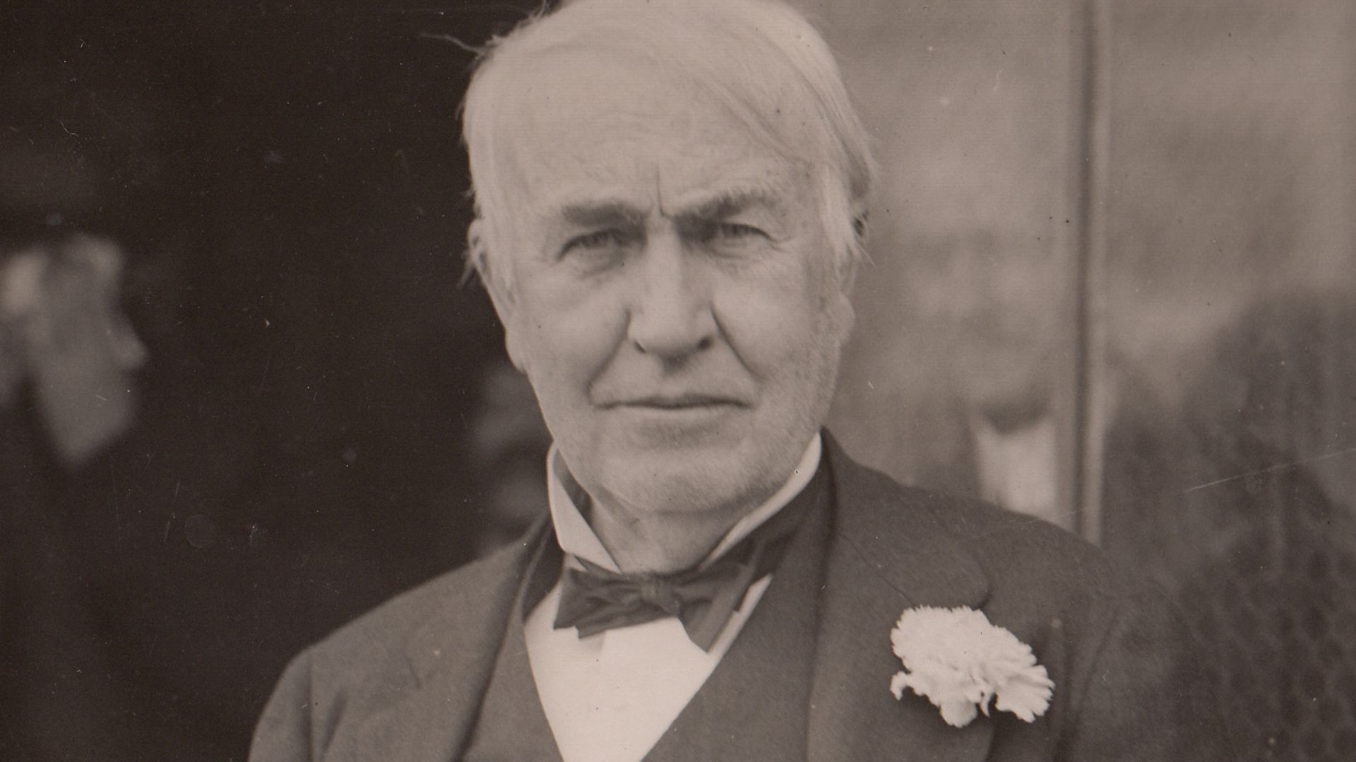 Thomas Edison and Mina Edison standing in doorway of Building 5 on his 73rd birthday. Thomas Edison Jr. stands behind them.
Keywords: thomas edison; mina miller edison; thomas edison jr.; laboratory complex; building 5; building 5 exterior; birthdays; fam