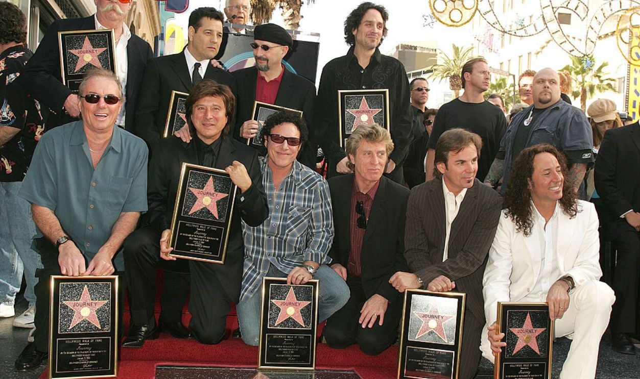 Back: George Tickner, Robert Fleischman, Steve Smith and Deen Castronovo Front: Aynsley Dunbar, Steve Perry, Neal Schon, Ross Valory, Jonathan Cain and Steve Augeri of Journey