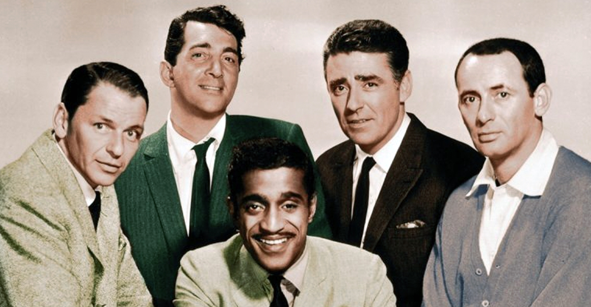  The Rat Pack circa 1960: The members of the Rat Pack posing in a full-length studio portrait. L-R: Frank Sinatra (1915 - 1998), Dean Martin (1917 - 1995), Sammy Davis, Jr (1925 - 1990, centre), Peter Lawford (1923 - 1984), and Joey Bishop. 