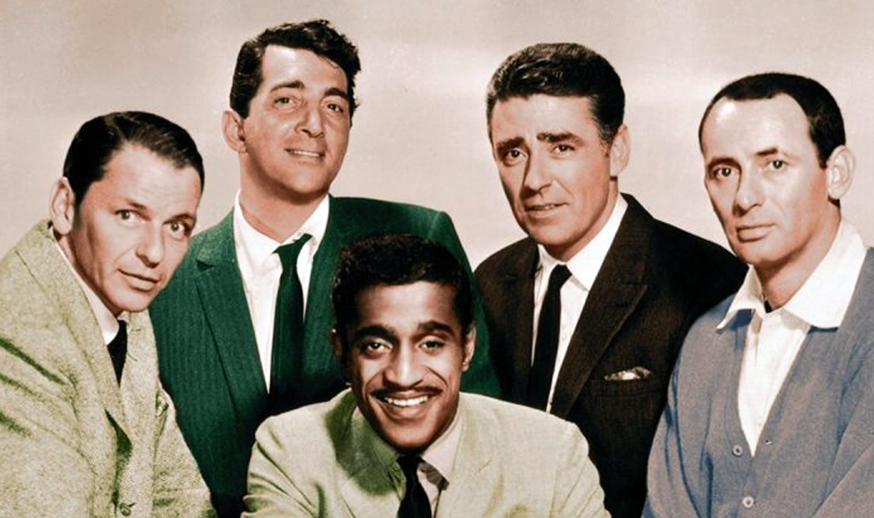 The Rat Pack circa 1960: The members of the Rat Pack posing in a full-length studio portrait. L-R: Frank Sinatra (1915 - 1998), Dean Martin (1917 - 1995), Sammy Davis, Jr (1925 - 1990, centre), Peter Lawford (1923 - 1984), and Joey Bishop.