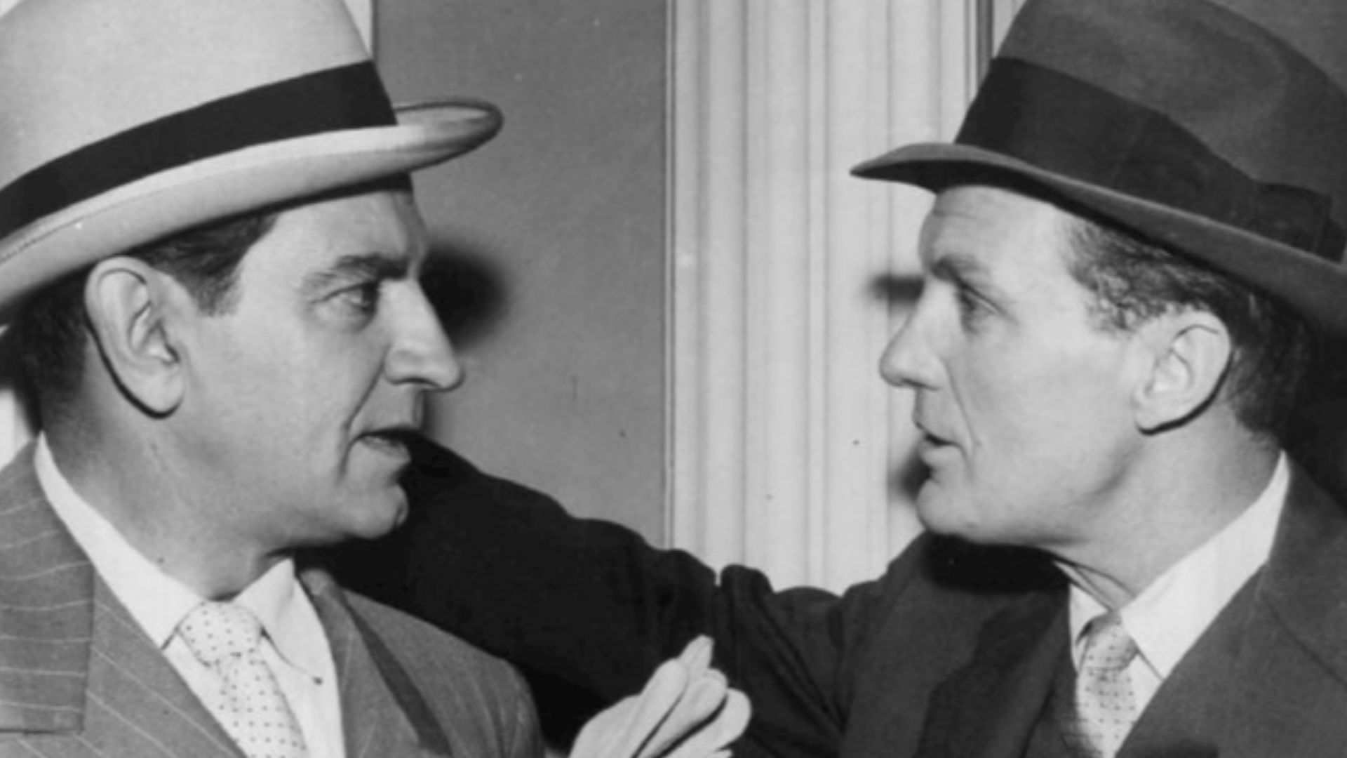 Photo of Bruce Gordon as Frank Nitti and Robert Stack as Eliot Ness in a scene from the television program The Untouchables.