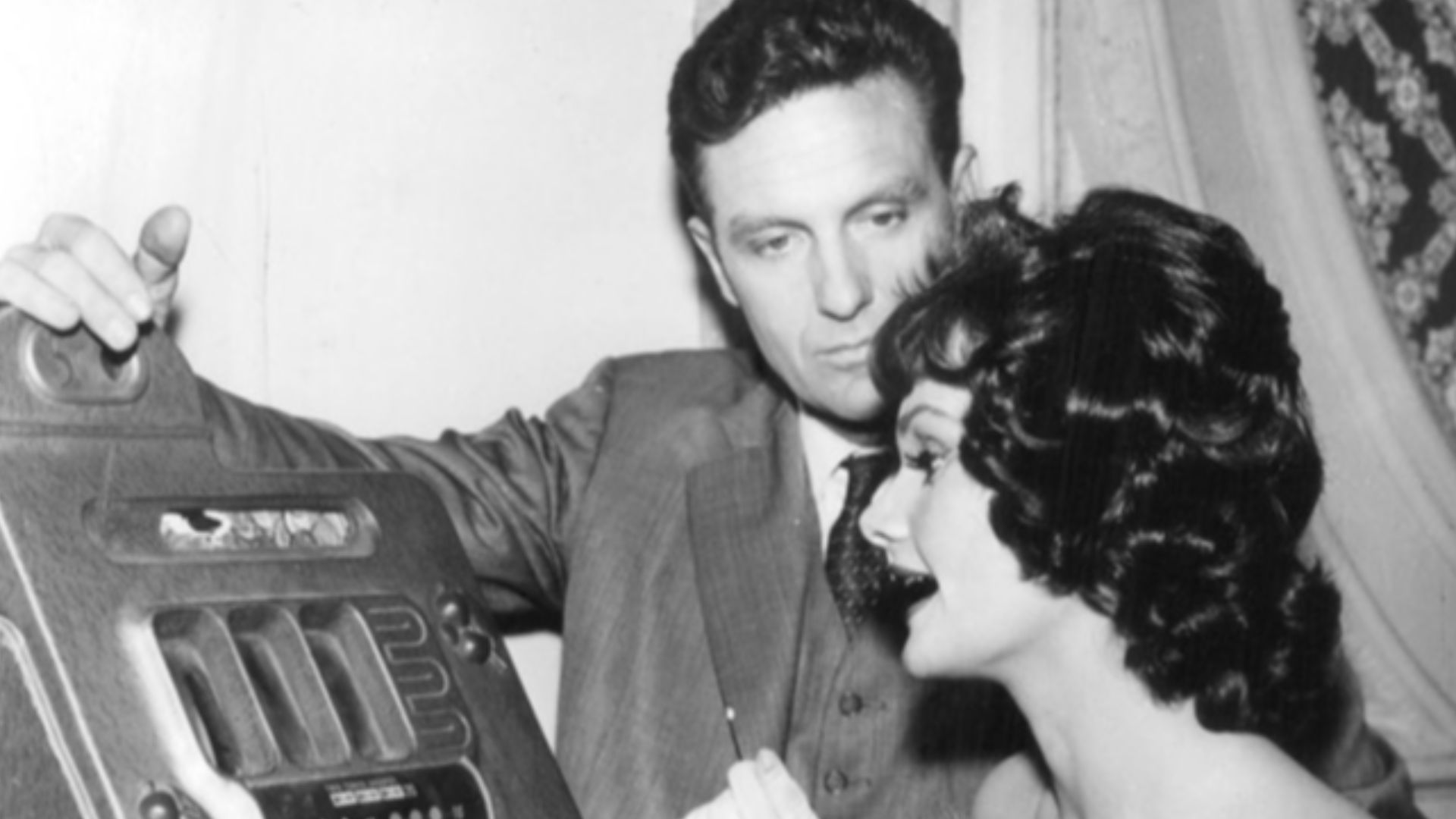 Publicity photo of Robert Stack as Eliot Ness and Gloria Talbott from the television program The Untouchables.