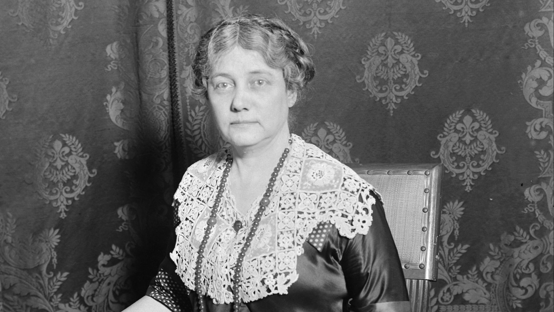 Portrait of Nellie Bly Sitting in chair, in her later years.
