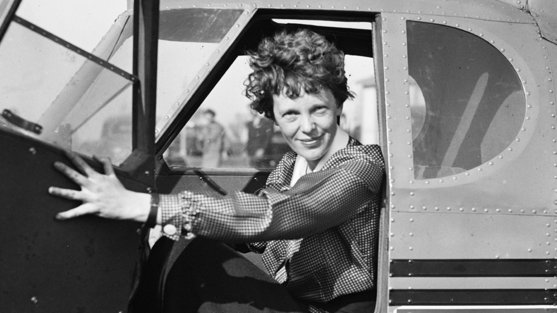[Amelia Earhart in airplane]