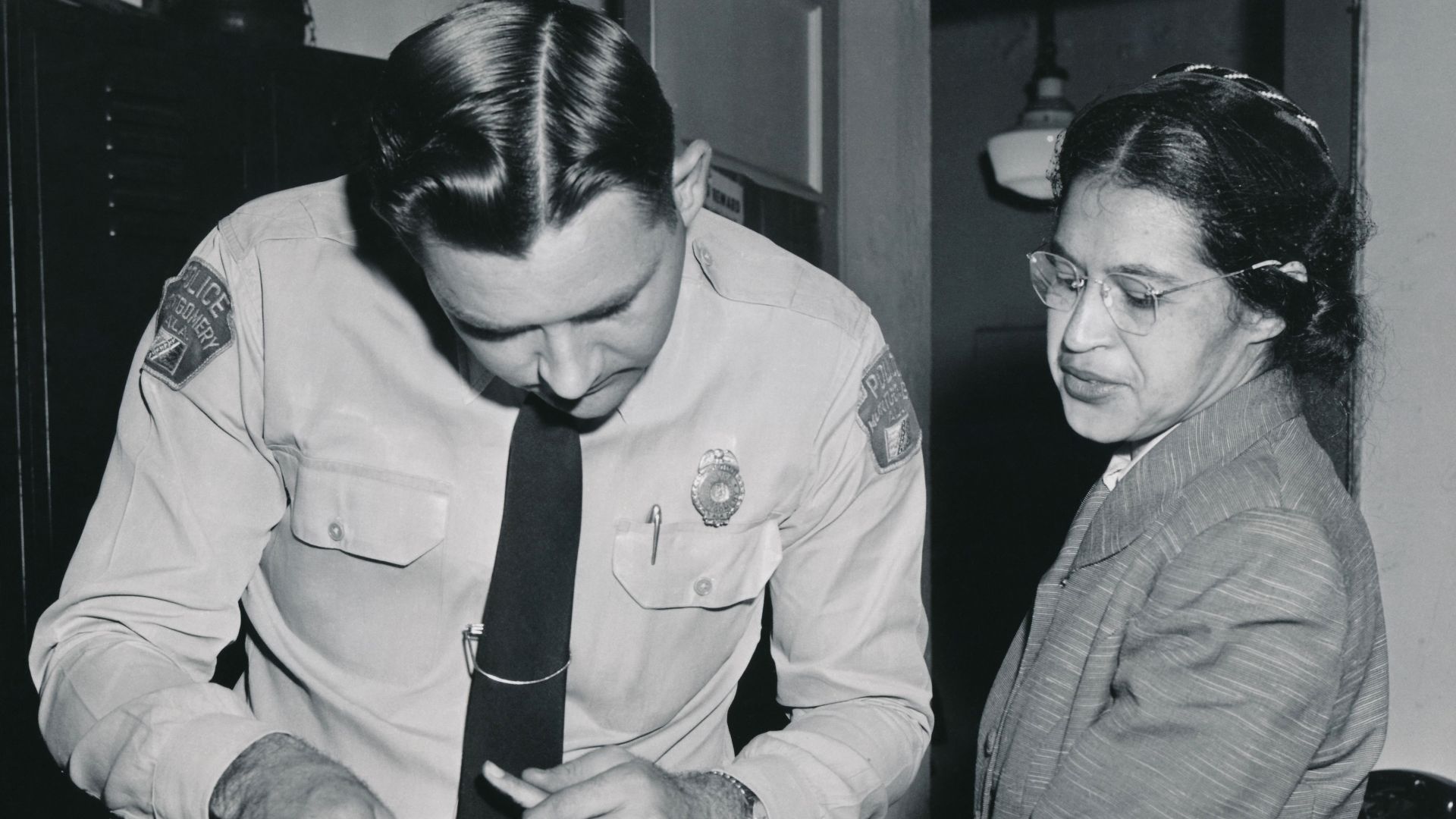 Rosa Parks being fingerprinted on February 22, 1956, by Deputy Sheriff D.H. Lackey as one of the people indicted as leaders of the Montgomery bus boycott. She was one of 73 people rounded up by deputies that day after a grand jury charged 113 African Amer