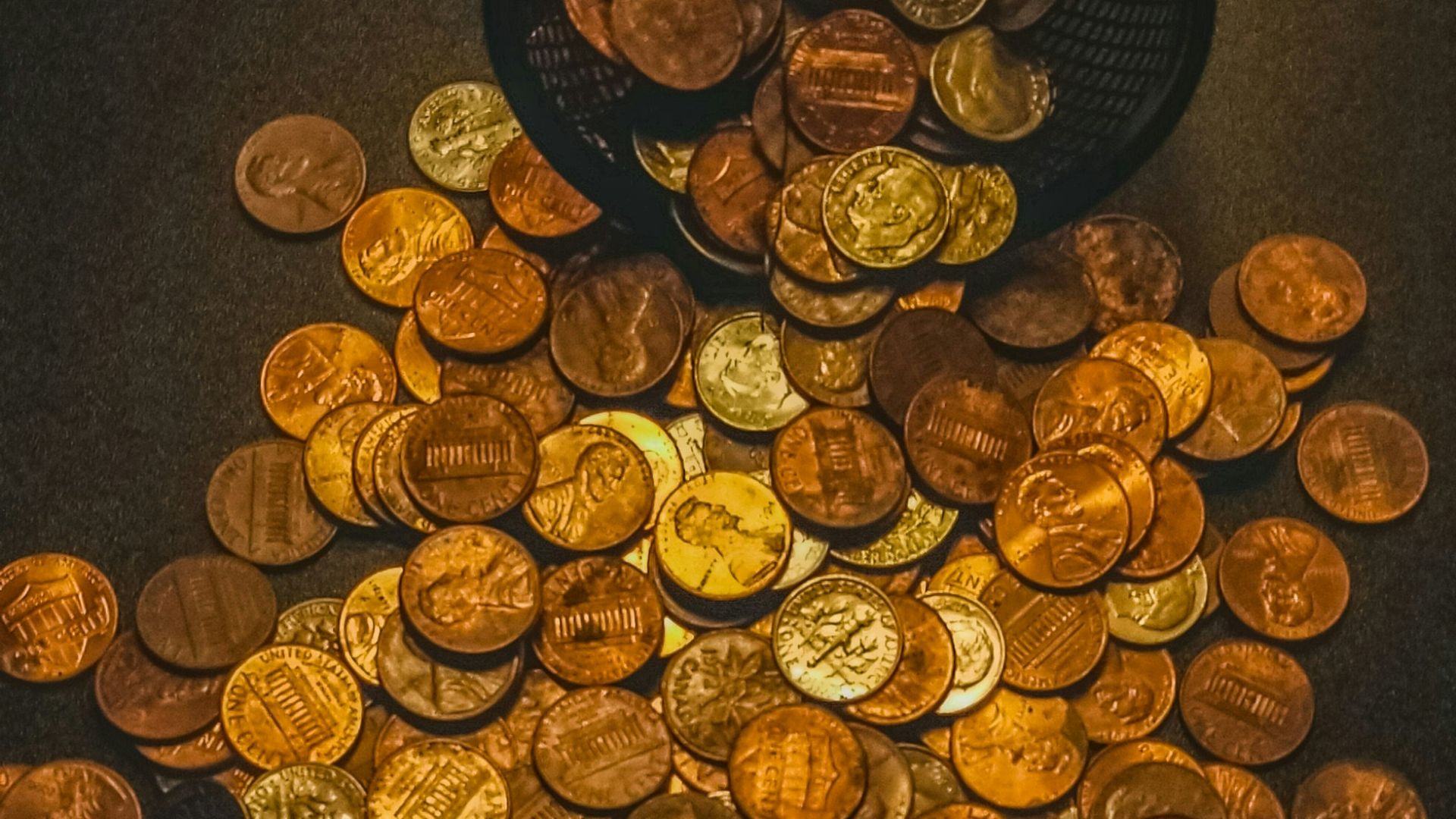 gold round coins on black textile