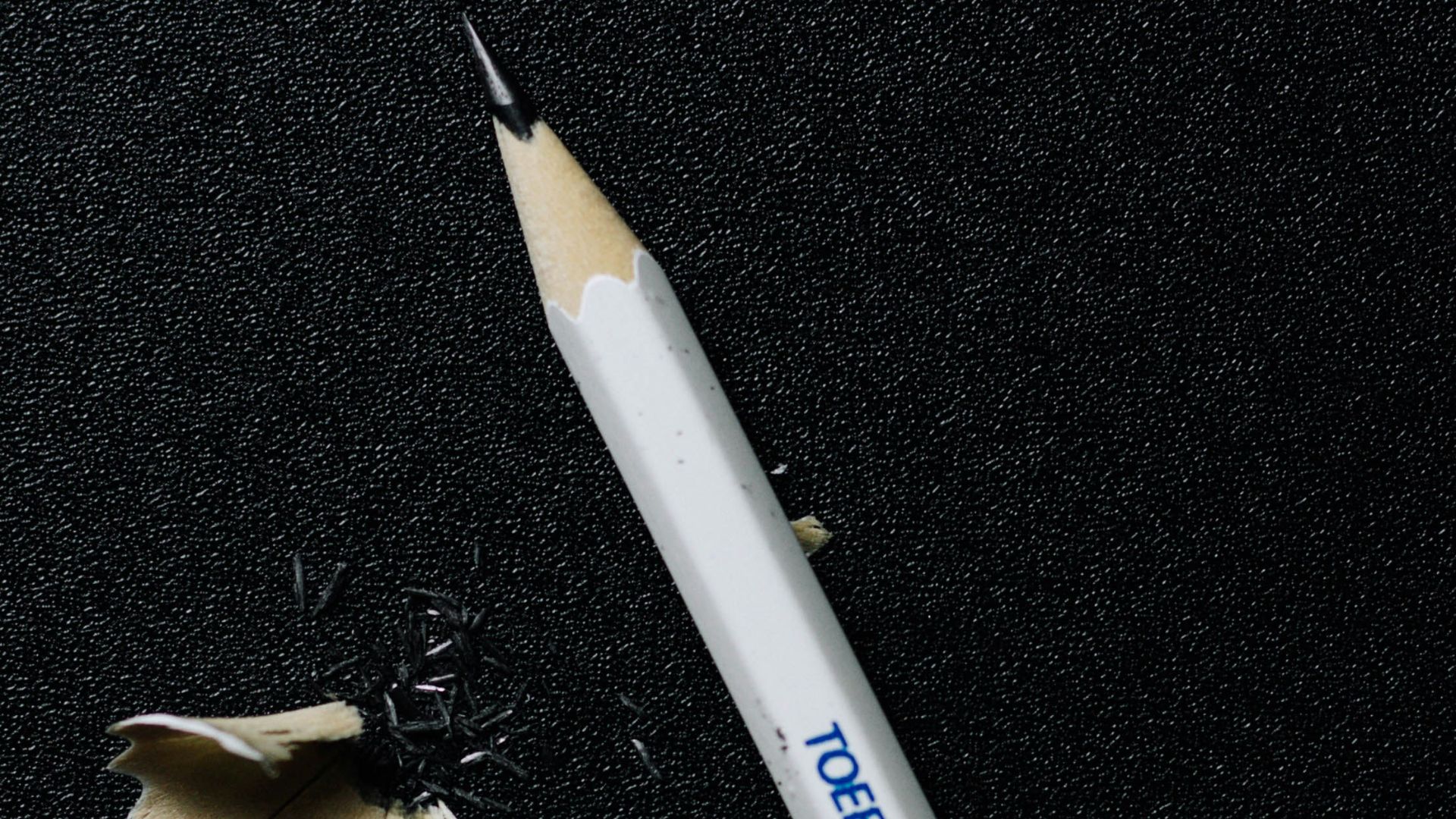 white and blue pencil on black textile