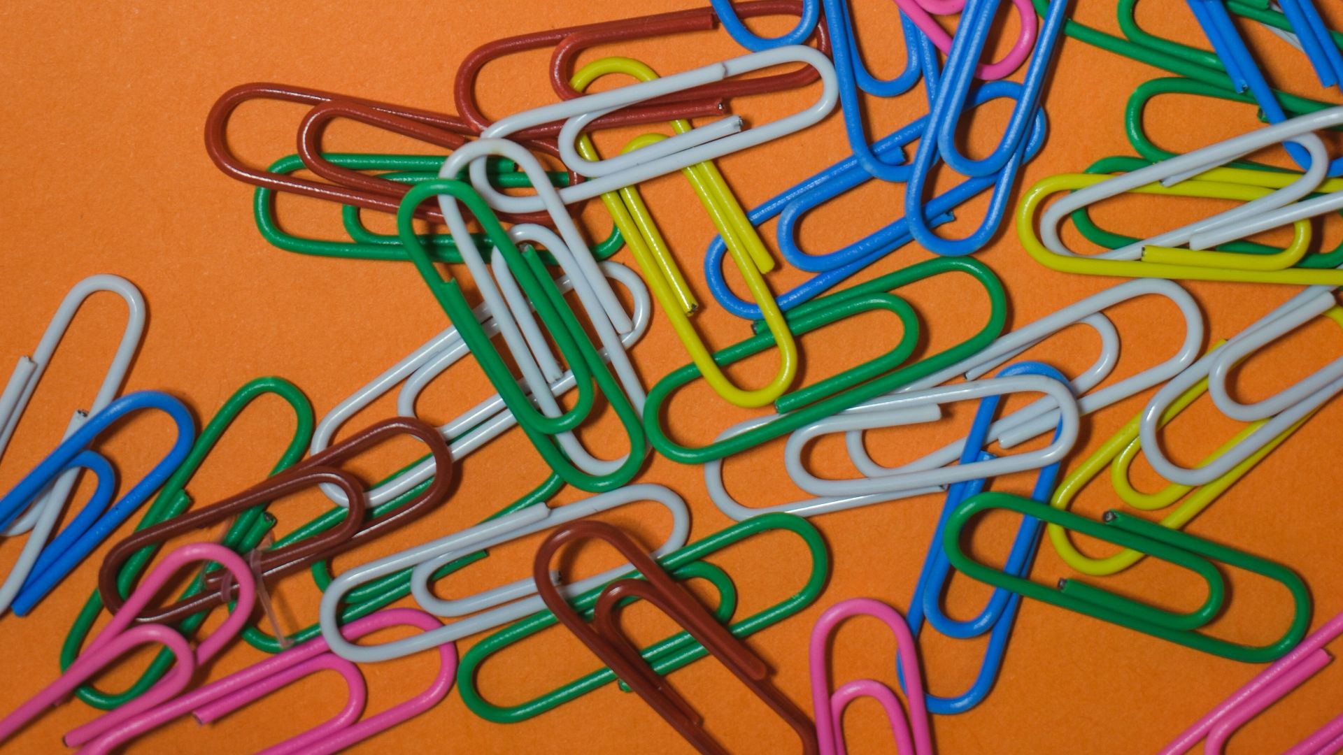 assorted-color safety pin collection