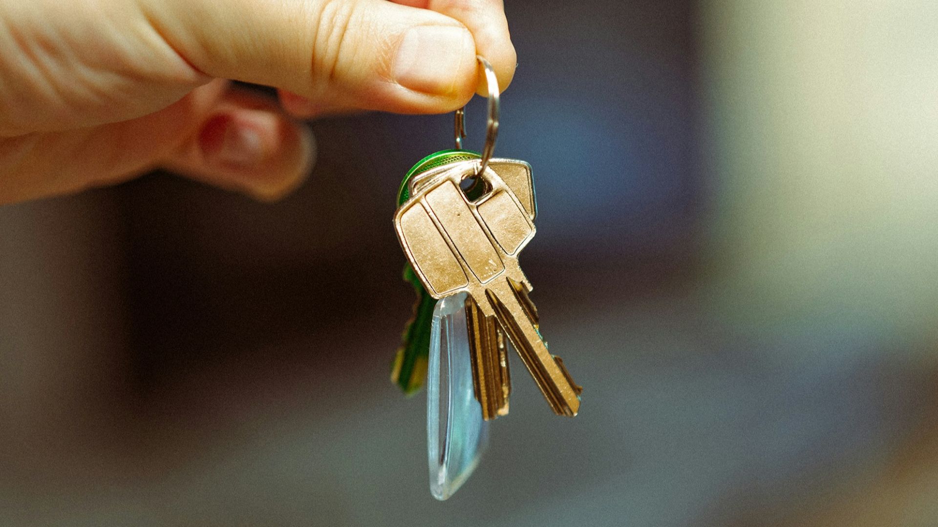 A person holding a bunch of keys in their hand