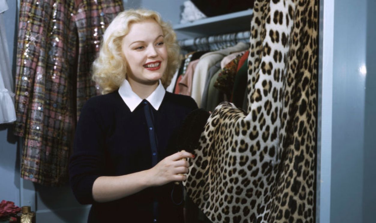 American actress June Haver looking at her wardrobe selection, circa 1946. 