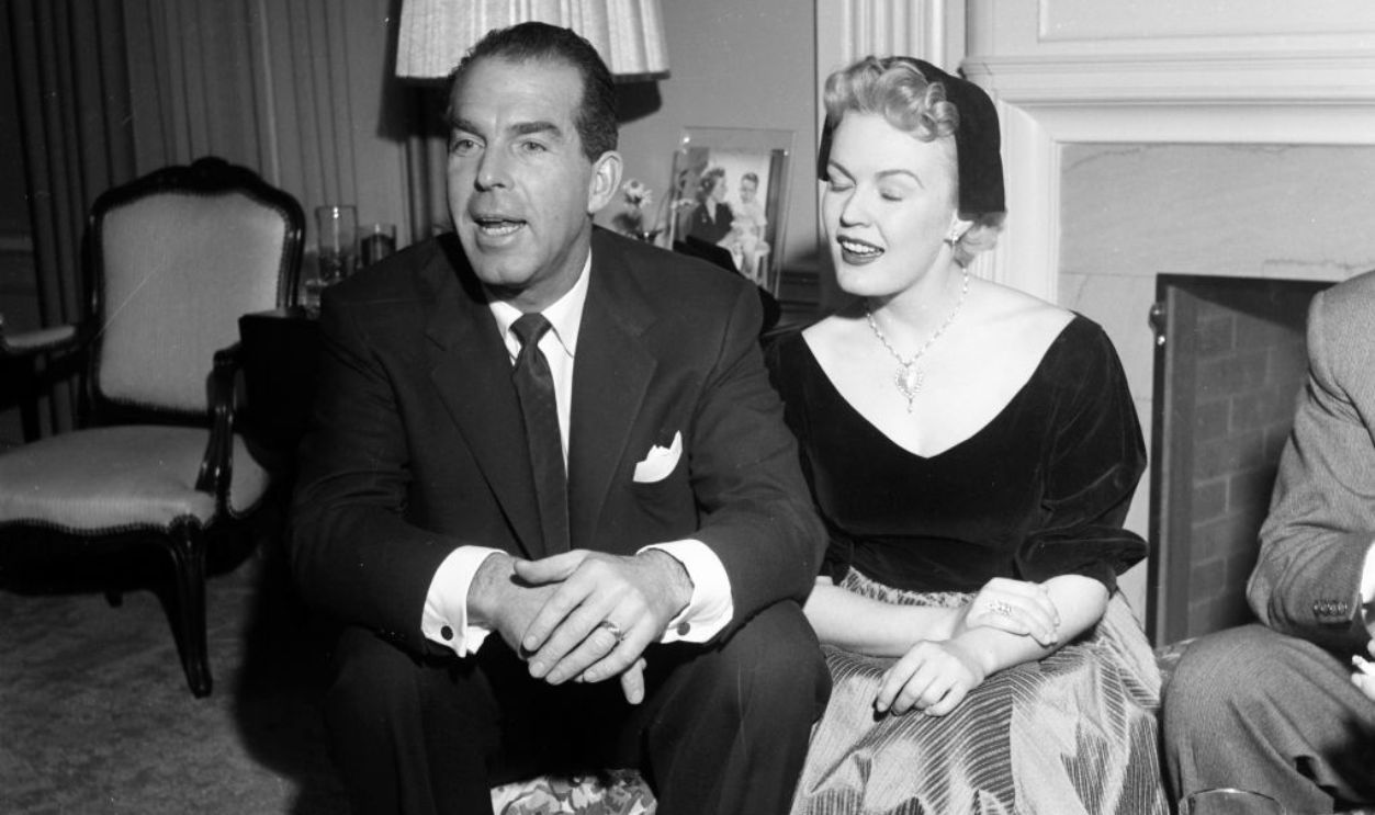LOS ANGELES - CIRCA 1954: Actress June Haver and husband actor Fred MacMurray attend a party in Los Angeles, California. 