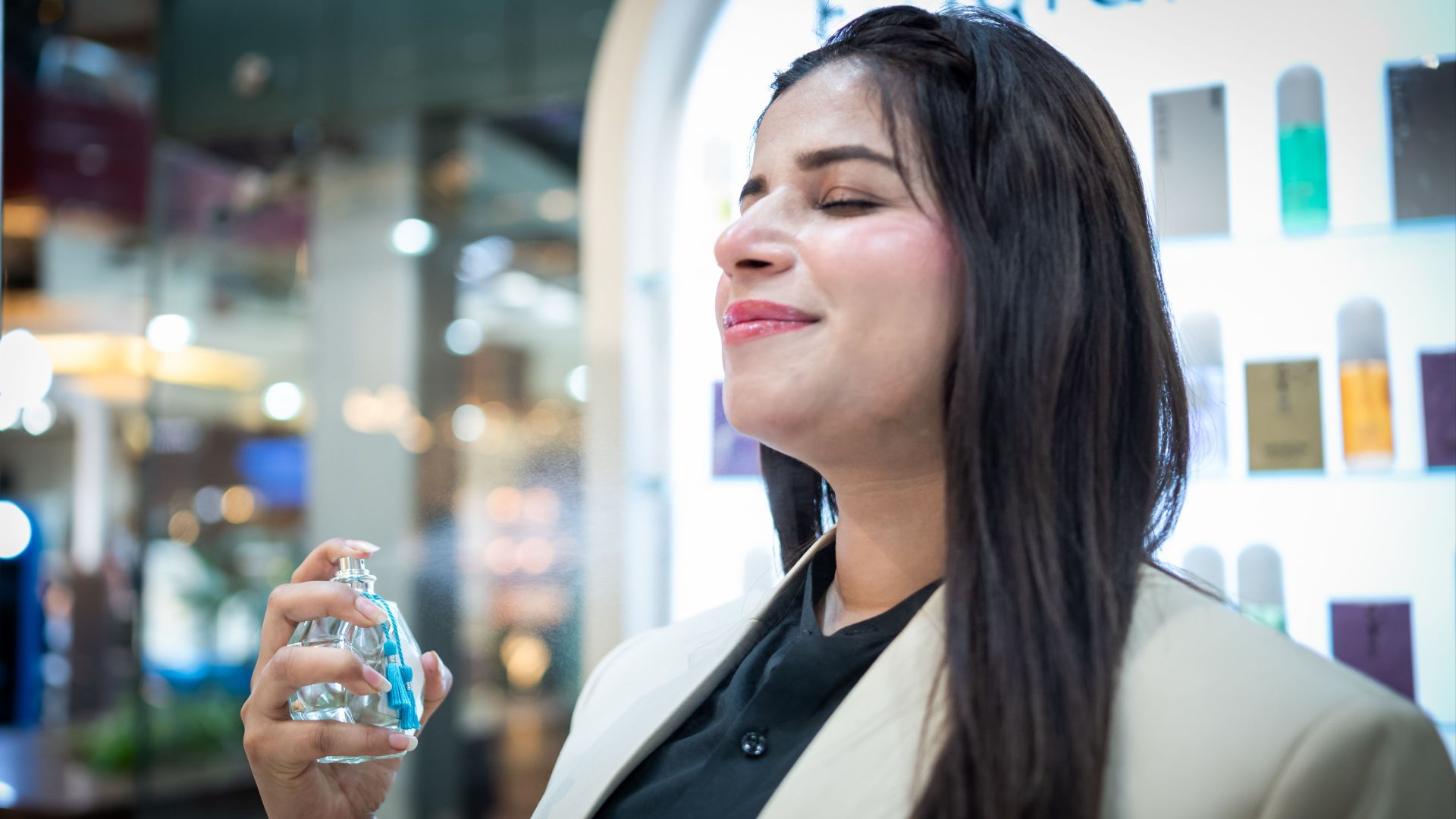 Stylish woman savoring a fresh fragrance in Islamabad boutique.