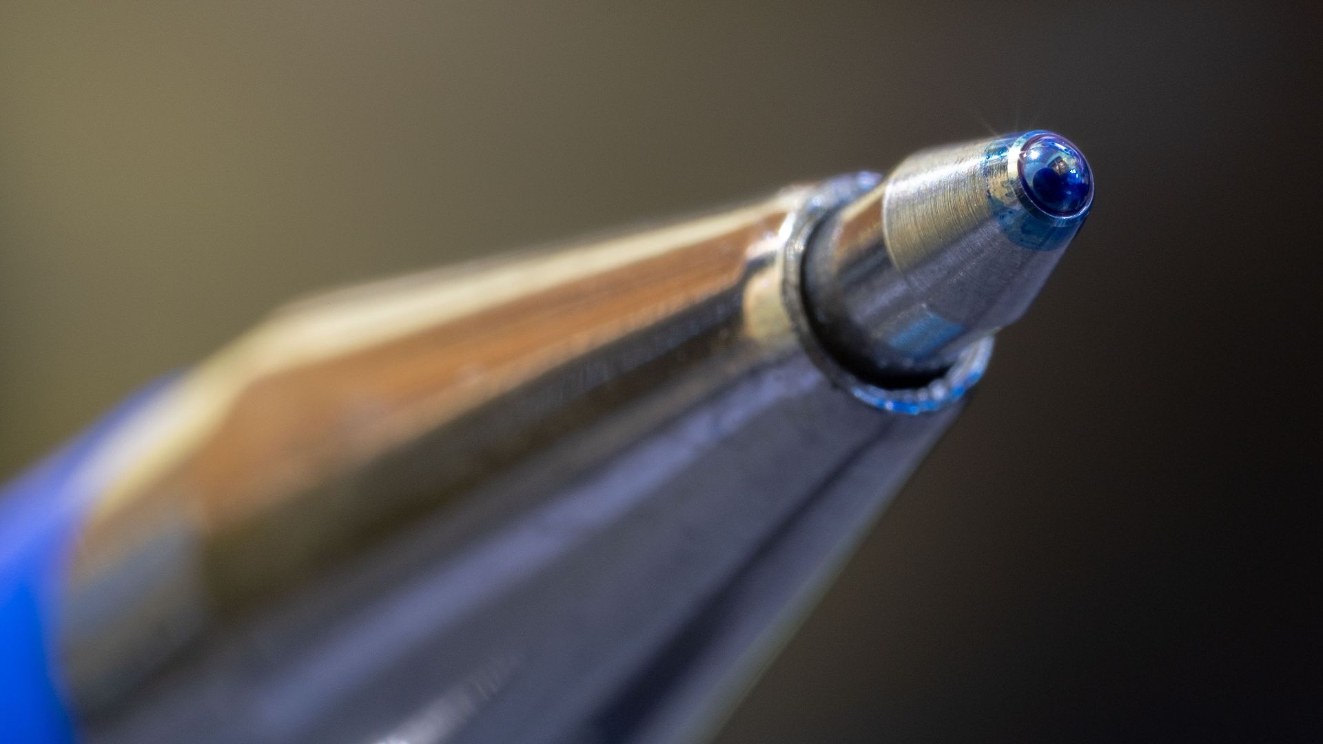 Macro shot highlighting the precision and design of a ballpoint pen tip.