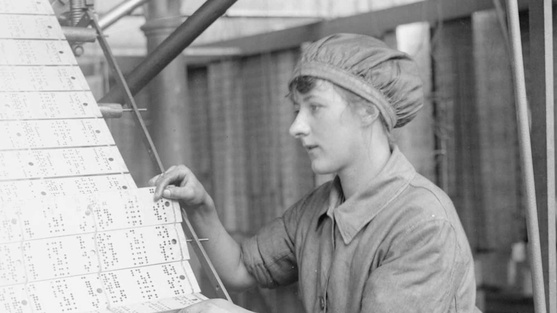Industry during the First World War- Leicestershire
A female worker changing jacquard cards in a lace machine in a Nottingham factory during the First World War.