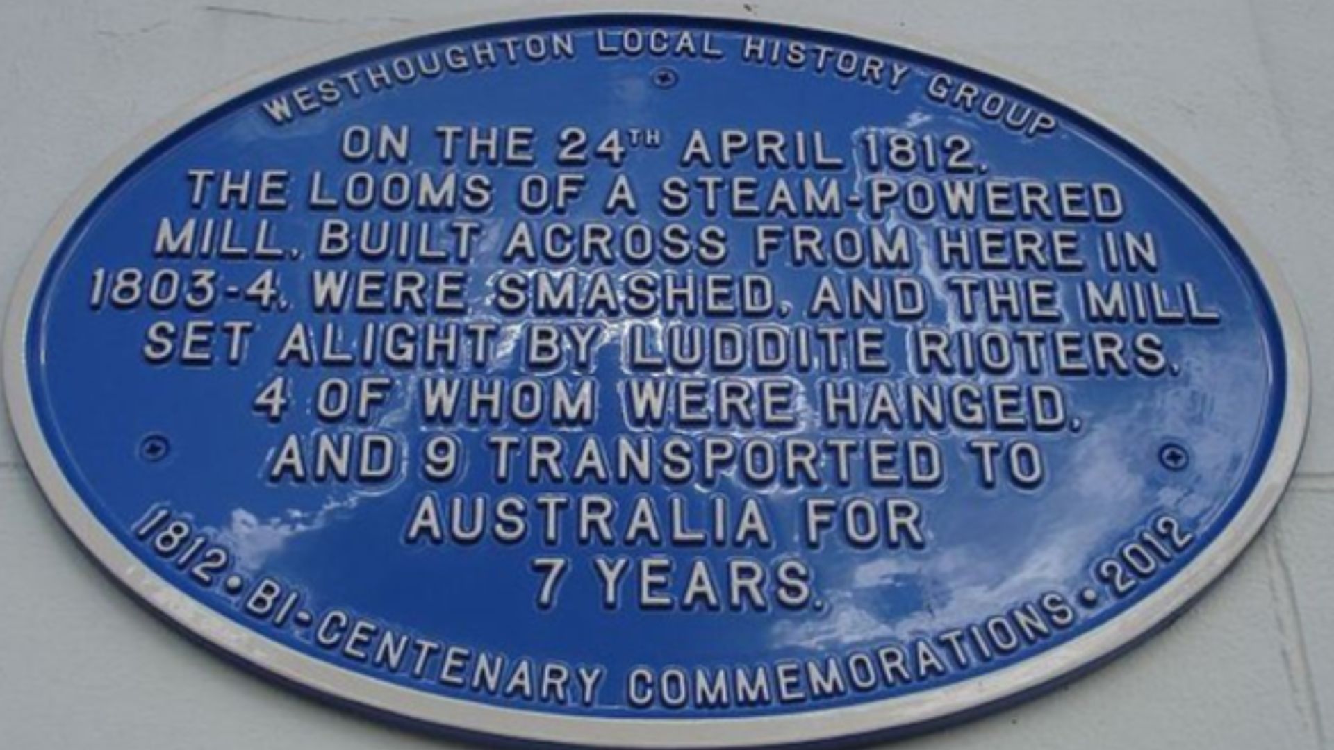 Blue Plaque on White Lion public house, Westhoughton, commemorating the burning of Westhoughton Mill in 1812.