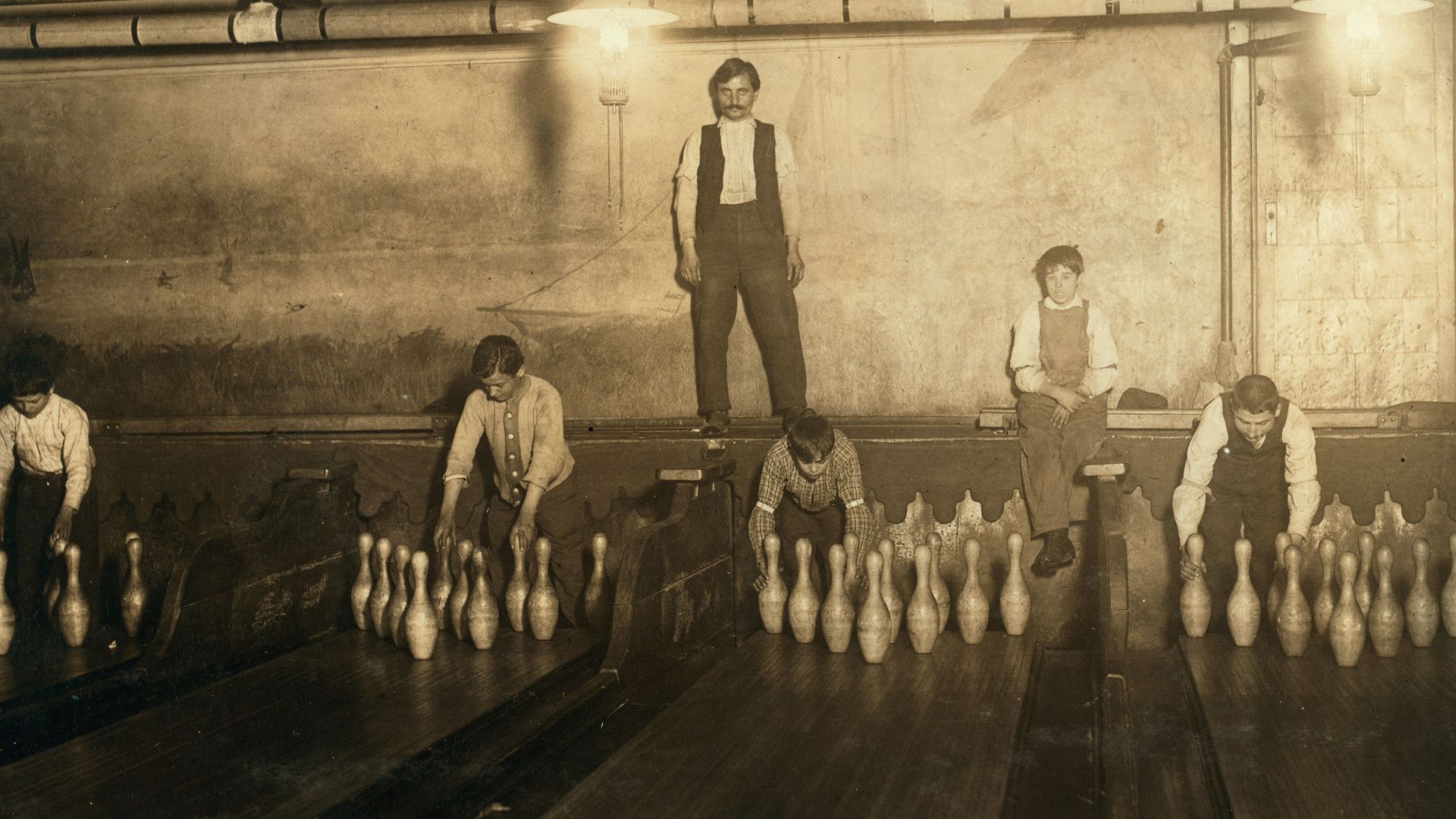 Title: 1:00 A.M. Pin boys working in Subway Bowling Alleys, 65 South St., B'klyn, N.Y. every night. 3 smaller boys were kept out of the photo by Boss.
Abstract: Photographs from the records of the National Child Labor Committee (U.S.)
Physical description