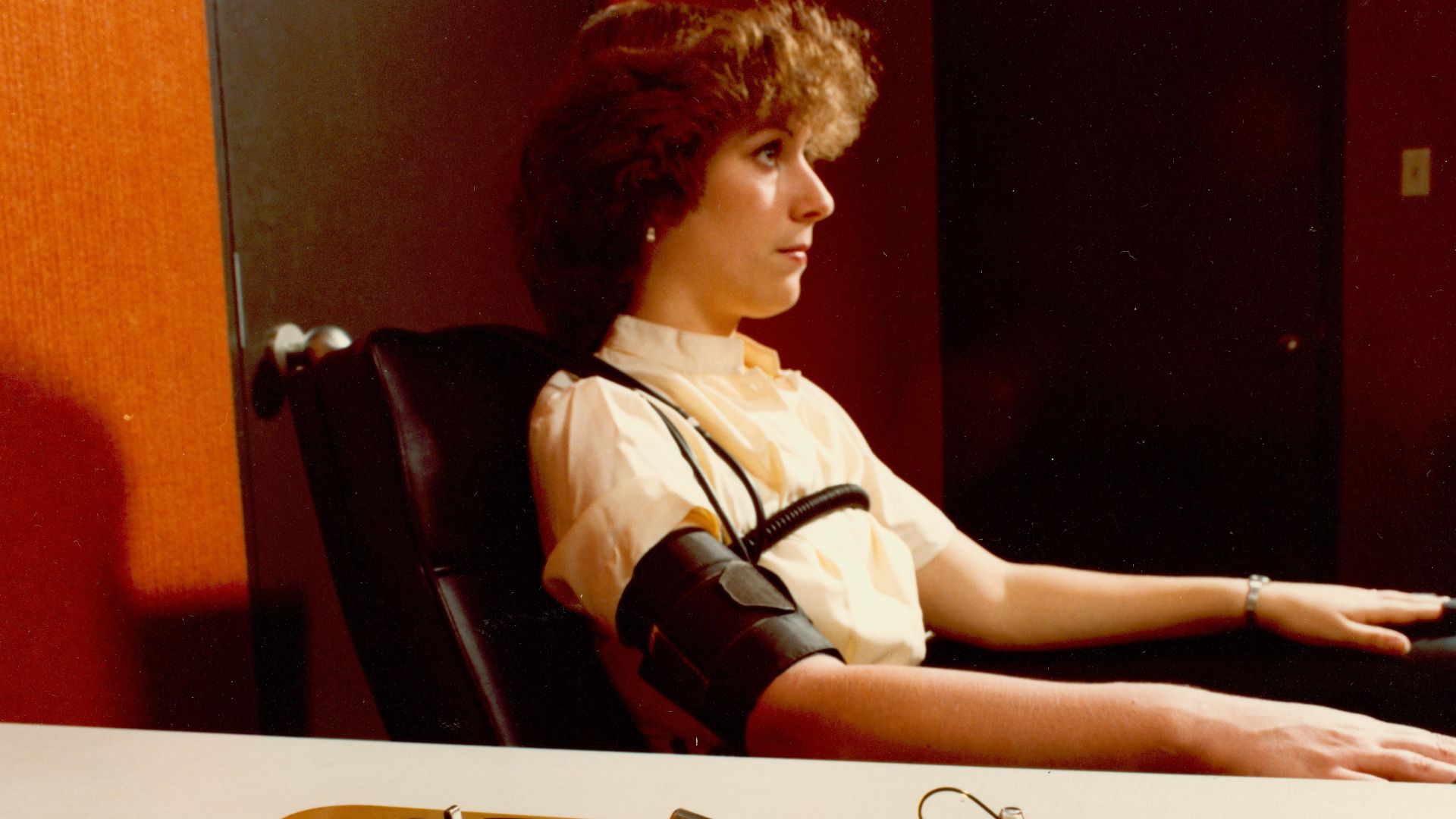Demonstrating the administration of the polygraph, the polygrapher making notes on the readouts.
Location: Washington, D.C.

Date range: 01/01/1970 to 12/31/1979