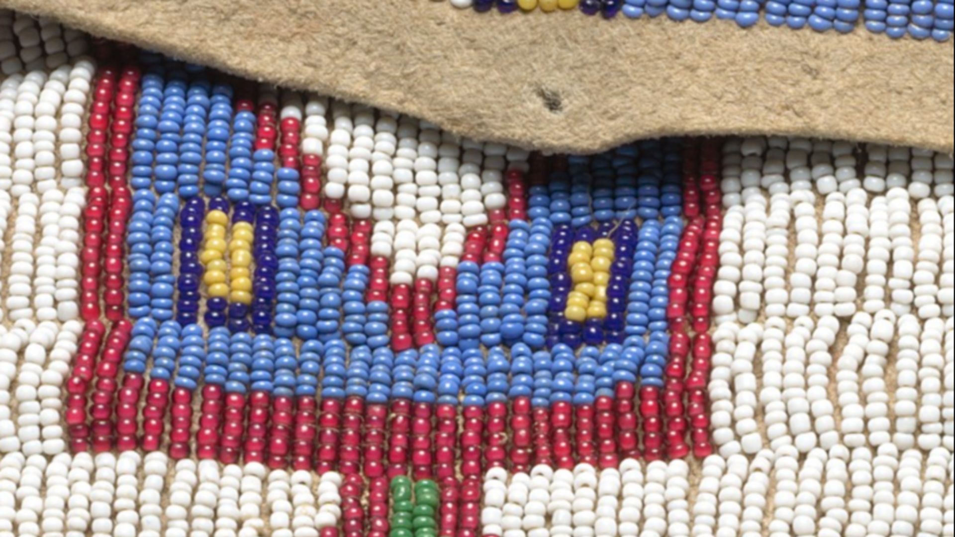 The beadwork of small glass beads on a late 19th century Lakota storage bag
