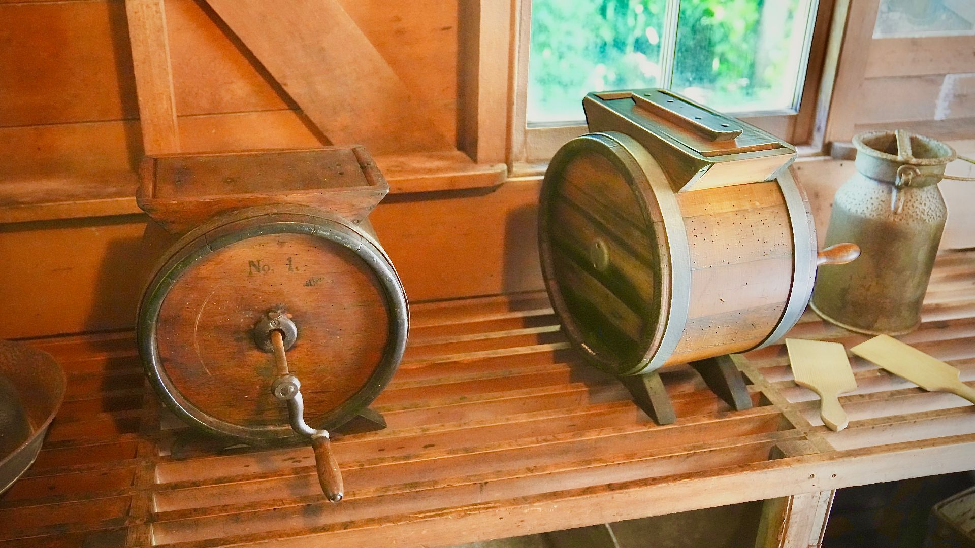 Two butter churns and a cream can at the The Elms - Formerly the Te Papa Mission Station.