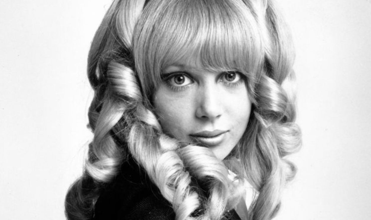 1967: Fashion model Patti Boyd, wife of Beatle George Harrison, modelling a wig.