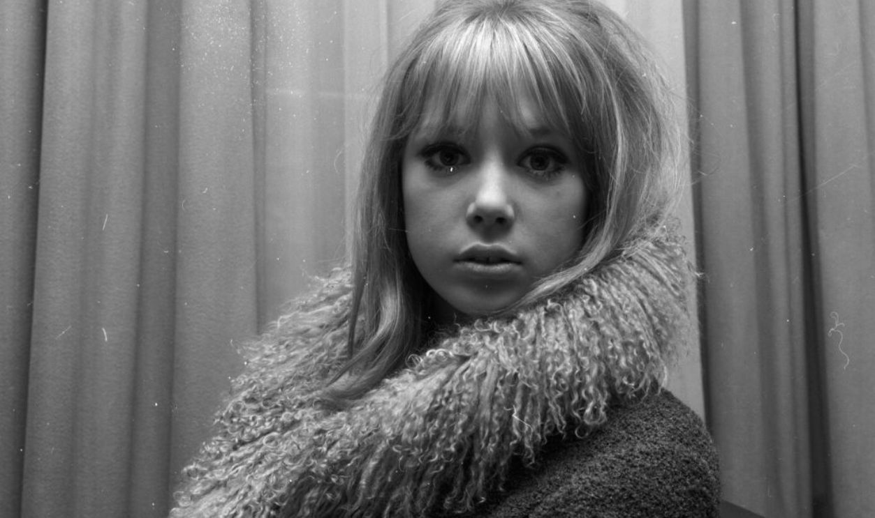 Portrait of model and actress Pattie Boyd wearing a fur lined coat, March 3rd 1964.