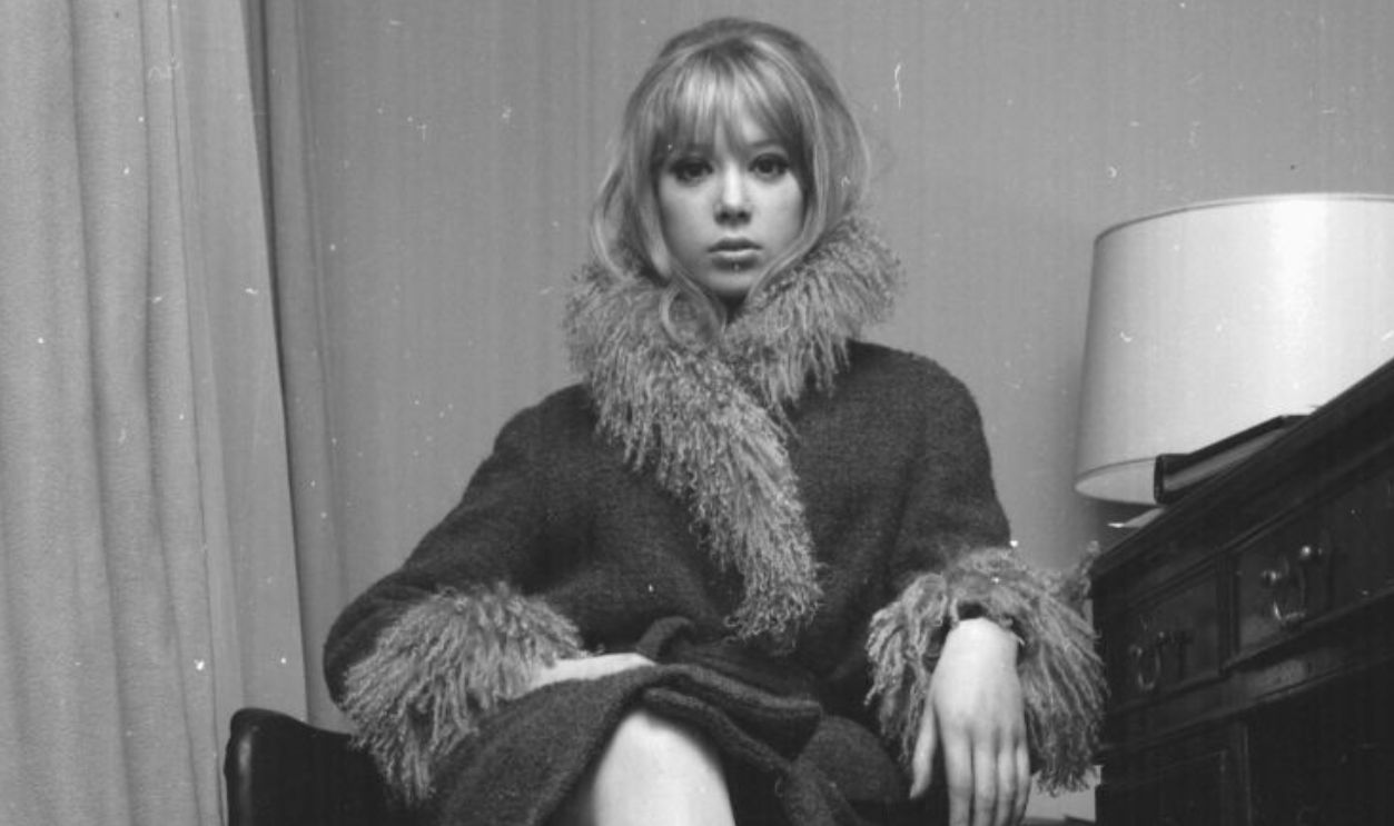 Portrait of model and actress Pattie Boyd wearing a fur lined coat, March 3rd 1964. 