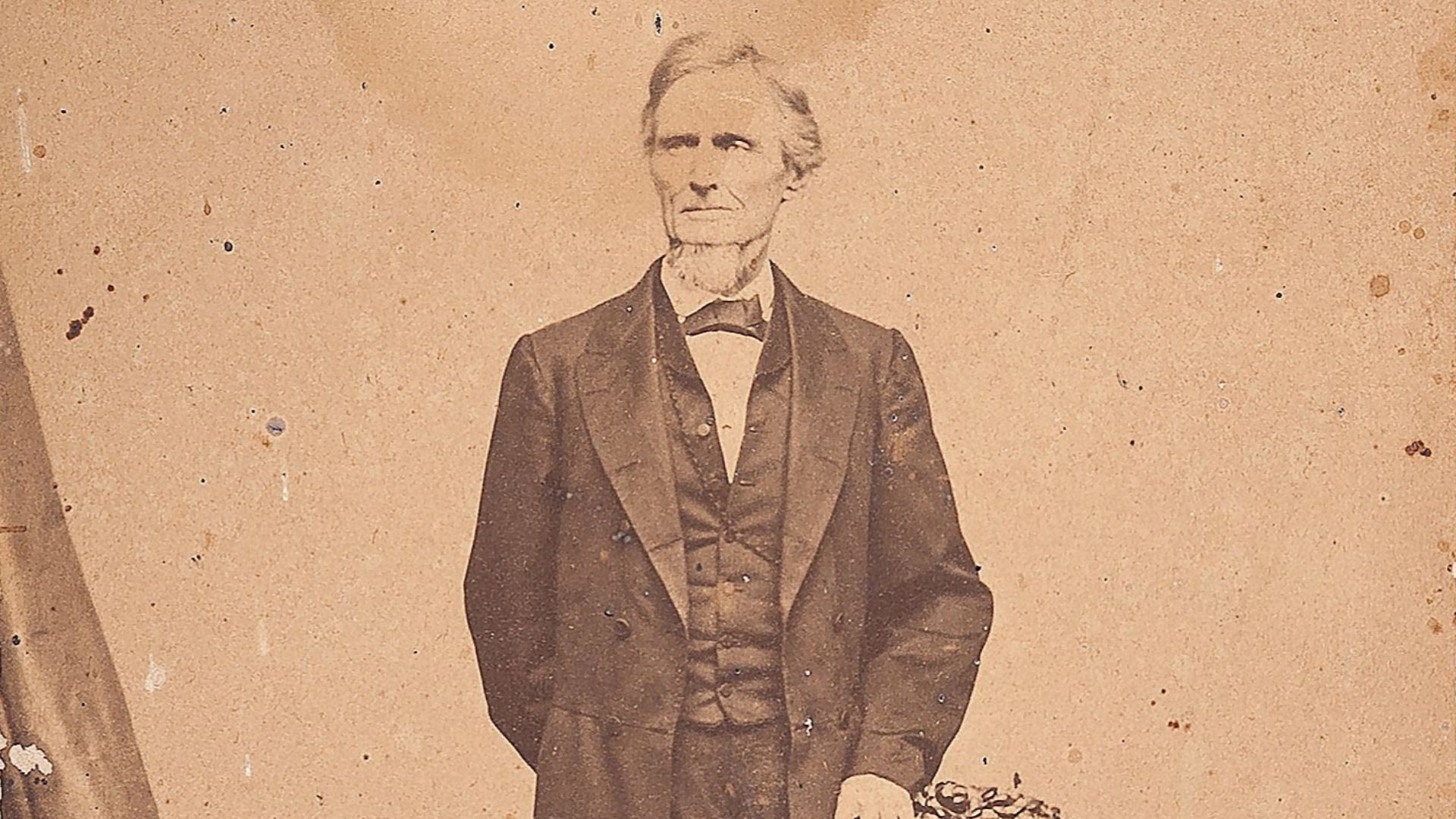 Albumen cabinet card of former Confederate President Jefferson Davis in a studio setting, on mount credited to Bendann Brothers, Baltimore. This was produced not long after Davis' release from Fortress Monroe in 1867.