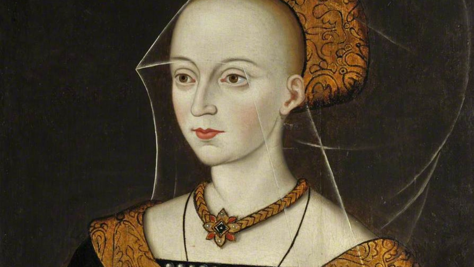 Elizabeth Woodville (1437-1492), Queen Consort of Edward IV of England.
The portrait of her shown here is probably a multiple-generation copy of one taken from life. The College has several versions in differing states. She is shown posed in the high fash