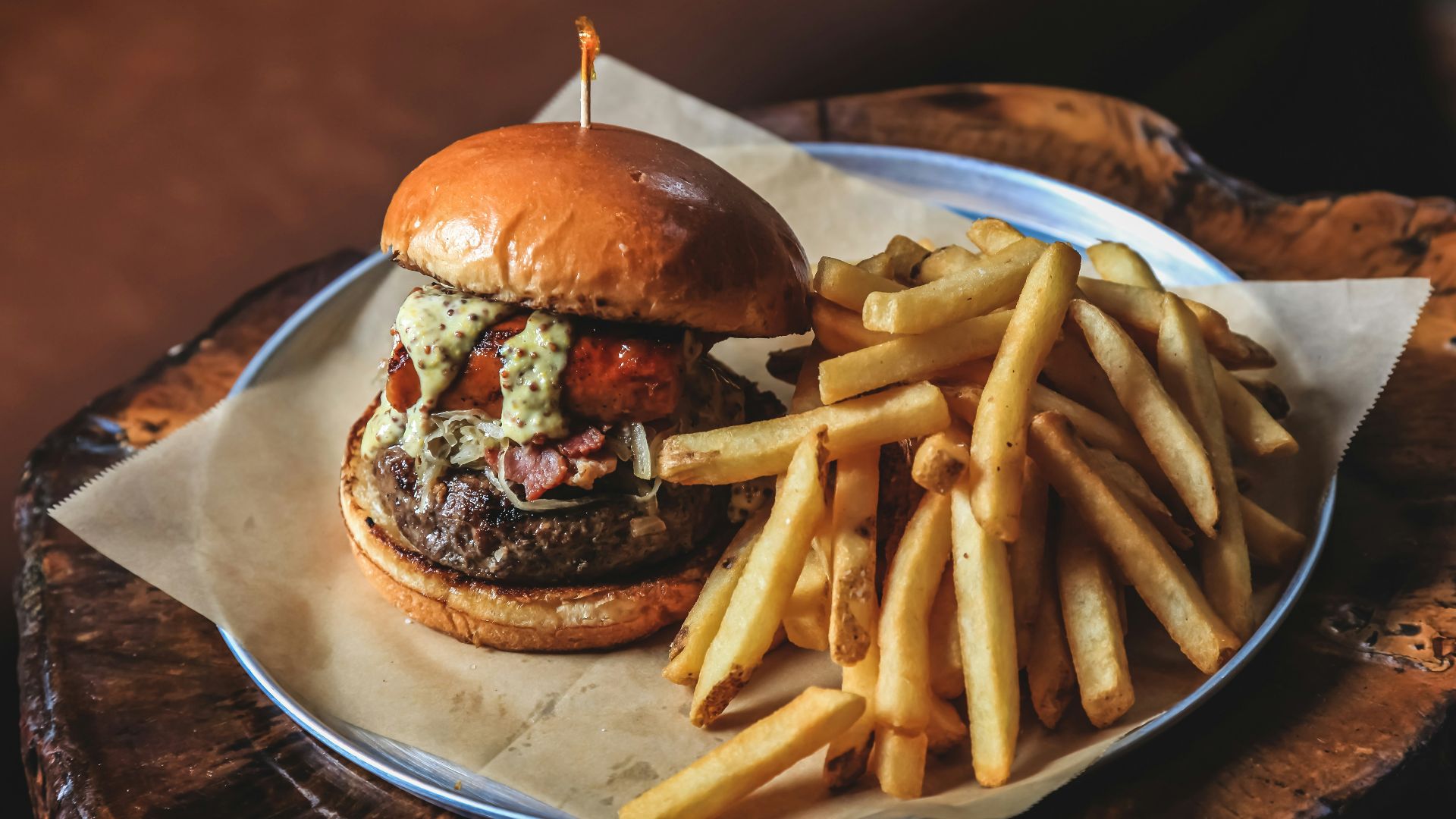 burger with fries on white ceramic plate