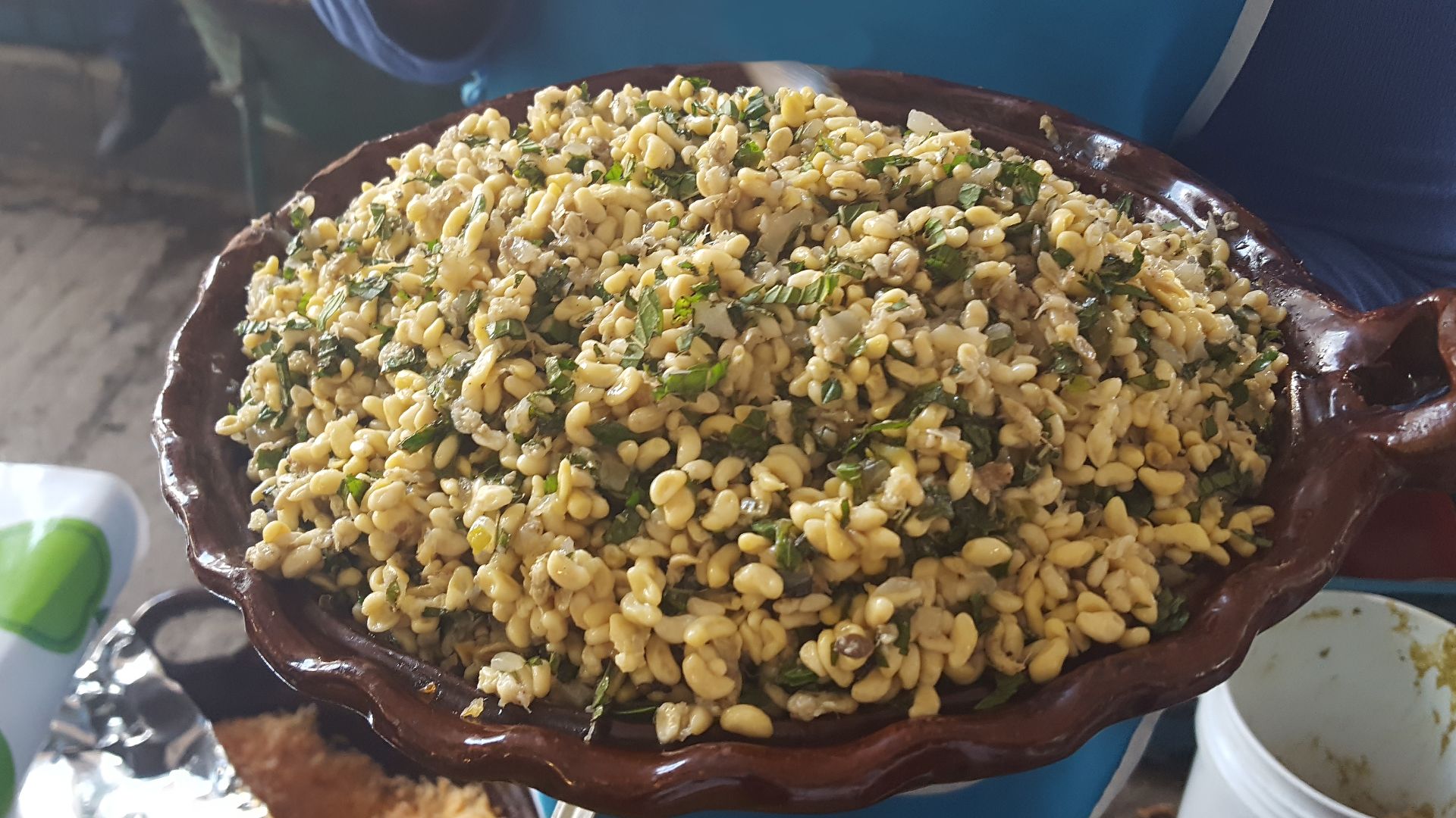 Clay casserole with escamoles (ant eggs) prepared with mint leaves, found at the XXXVIII Gastronomical fair of Santiago de Anaya, in the state of Hidalgo, Mexico.