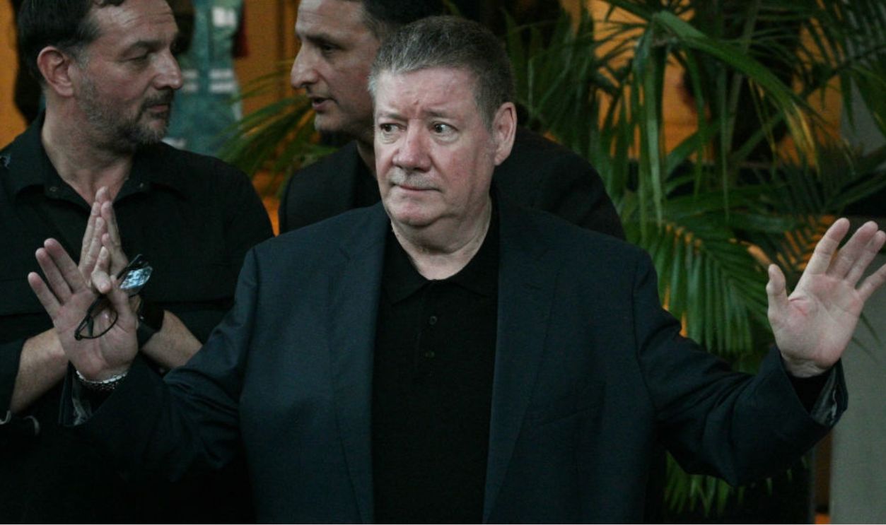 Geoff Payne (C), the father of One Direction pop singer Liam Payne, gestures as he visits the place where fans paid tribute to his late son outside the CasaSur Hotel in Buenos Aires on October 18, 2024. The father of One Direction pop singer Liam Payne, whose death in a fall from a hotel balcony in Buenos Aires shocked the music world, arrived in Argentina on Friday, police sources told AFP. The singer suffered 