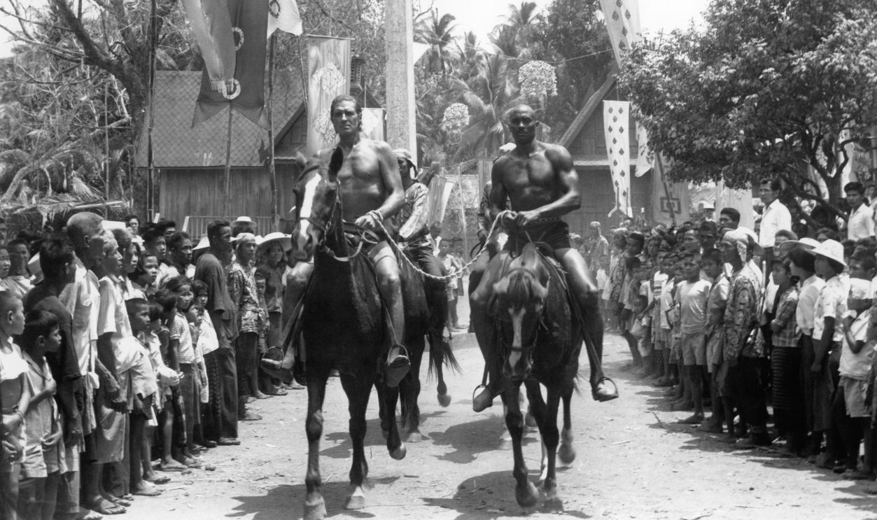 Gettyimages - 154509769, Jock Mahoney And Woody Strode In 'Tarzan's Three Challenges' Jock Mahoney and Woody Strode ride into the village on horseback in a scene from the film 'Tarzan's Three Challenges', 1963.