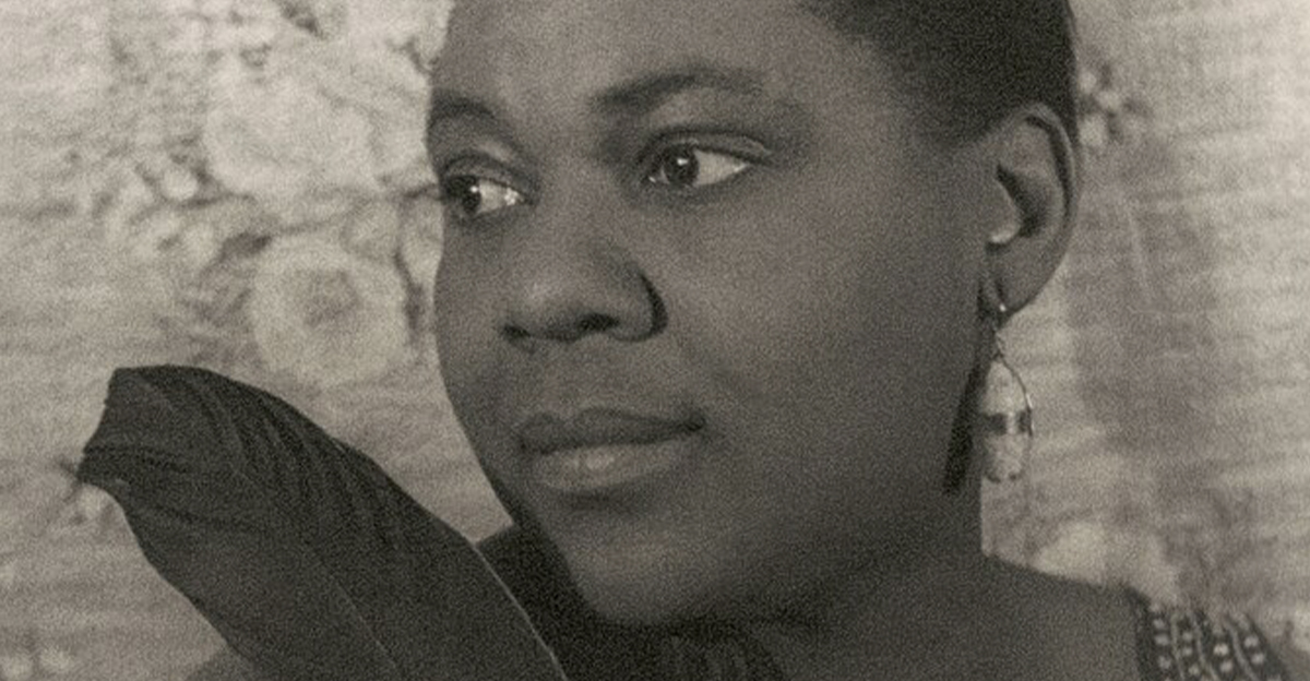 Portrait of Bessie Smith holding feathers