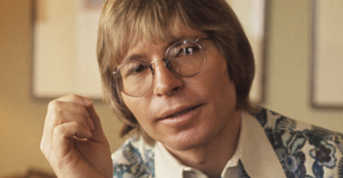 John Denver wearing glasses