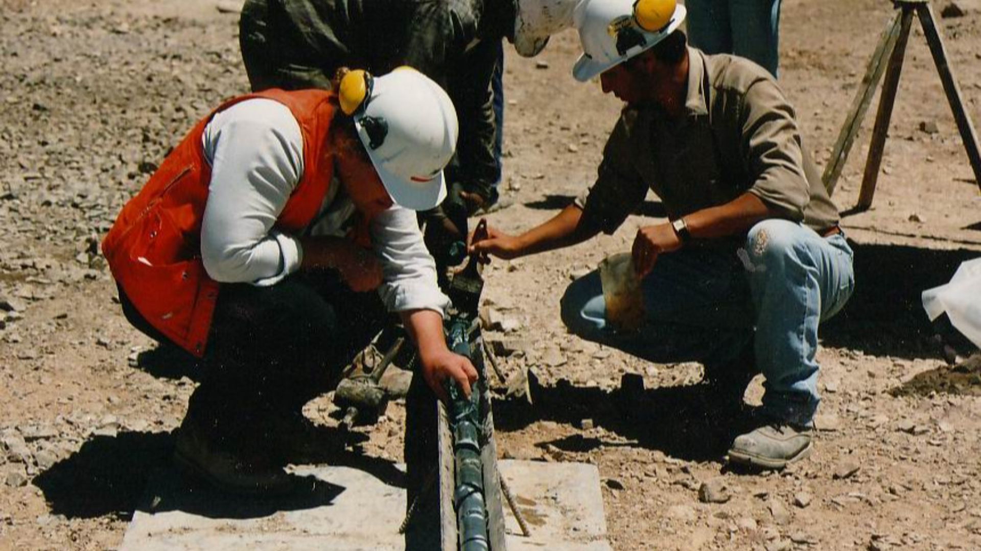 A geologist examining freshly recovered drill-core.
Photo taken by User:Geoz.

Chile, 1994.