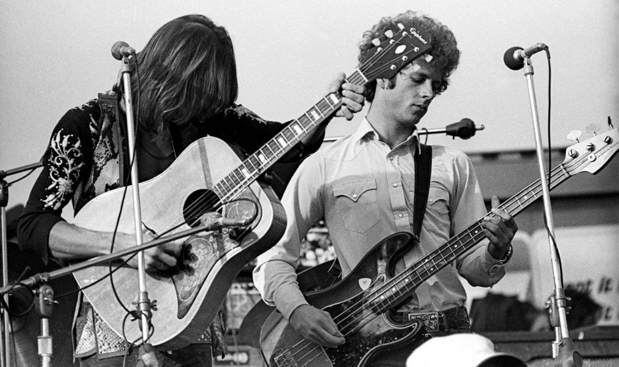 LIVERMORE, CA - DECEMBER 6: Gram Parsons and Chris Hillman of The Flying Burrito Brothers perform onstage at The Altamont Speedway on December 6, 1969 in Livermore, California. 