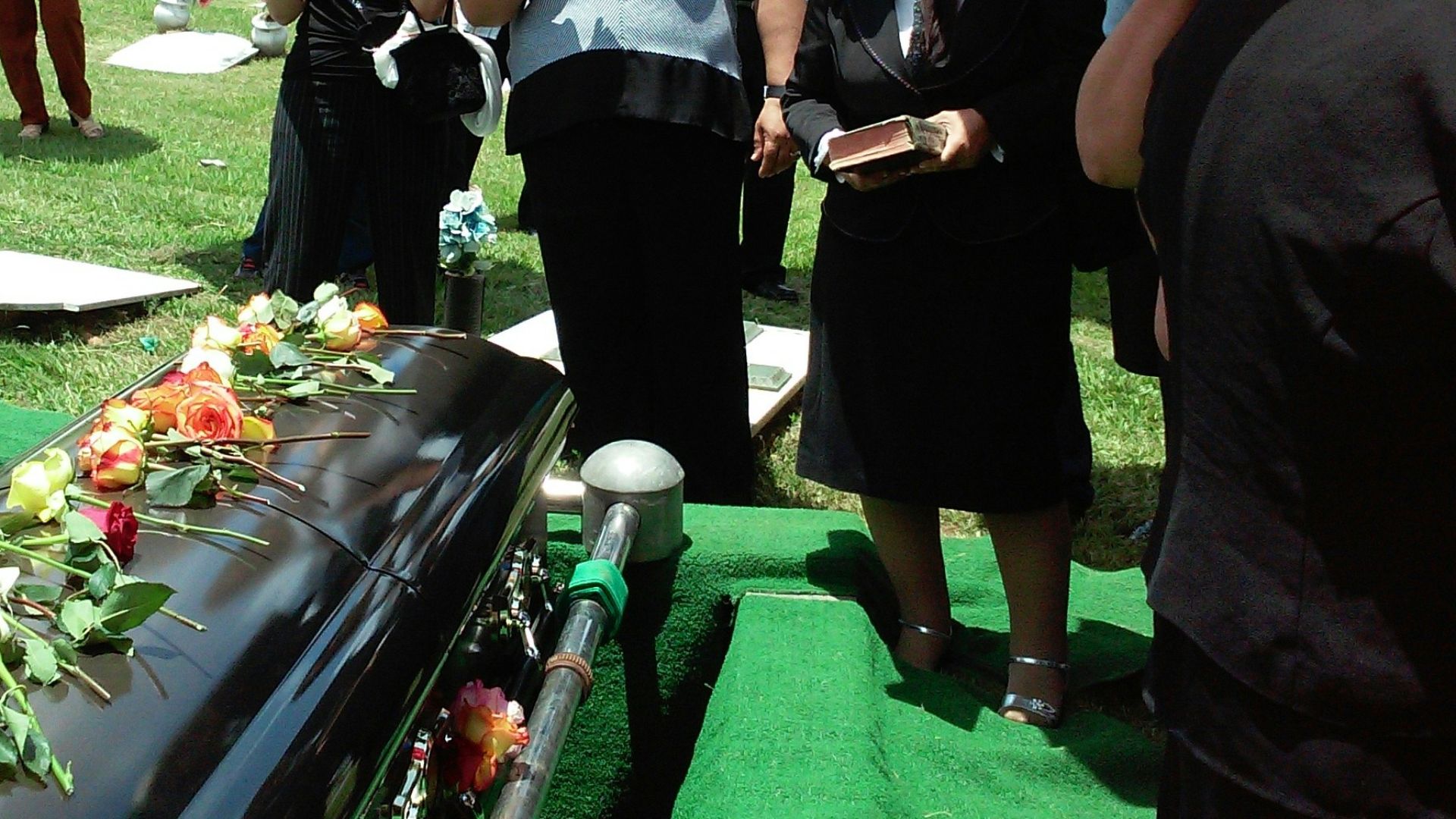group of people attending burial