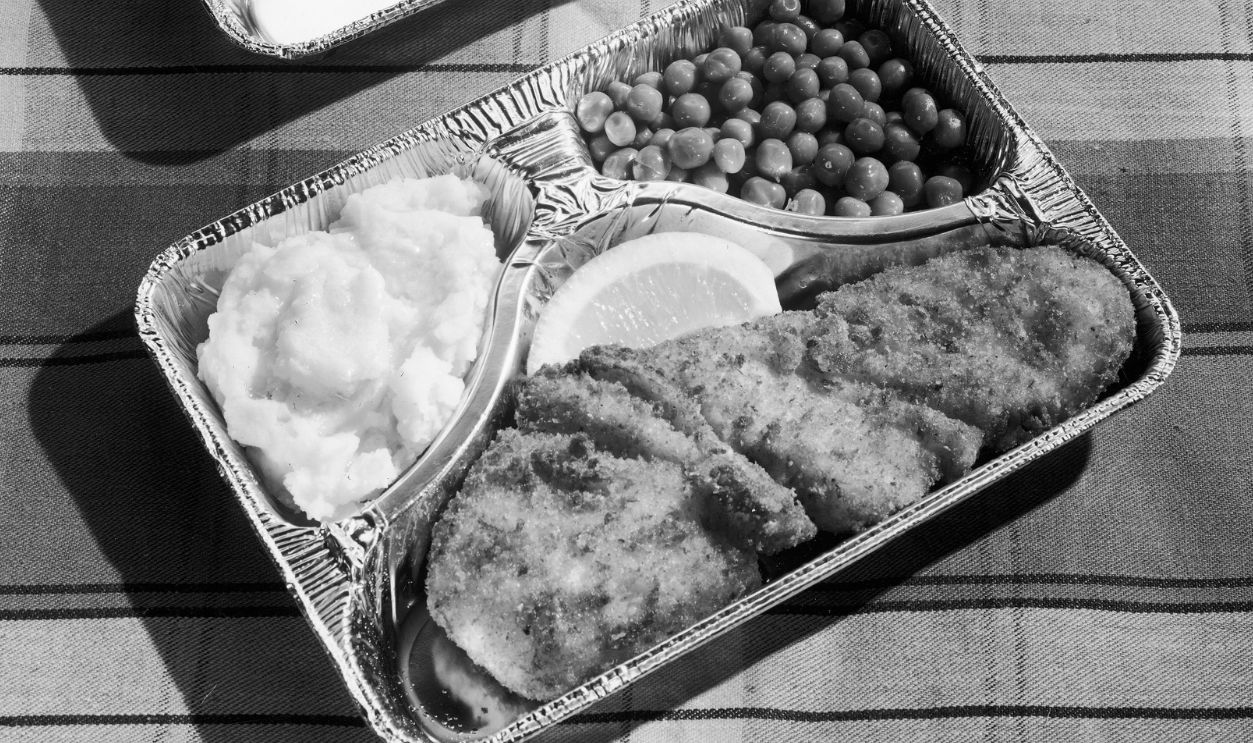 TV Dinner circa 1955: Still-life of a three-hold aluminum tray, 'TV dinner'.