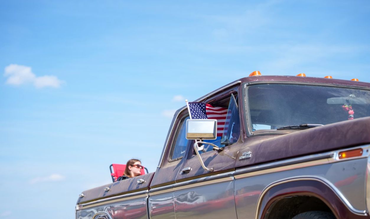 Woman looking out of a vintage truck window