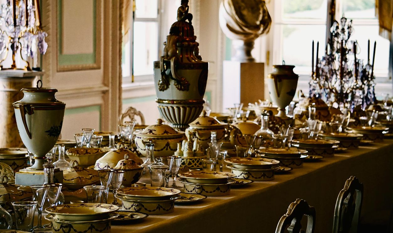 Luxurious dining table adorned with elegant porcelain at Peterhof Palace, Russia.