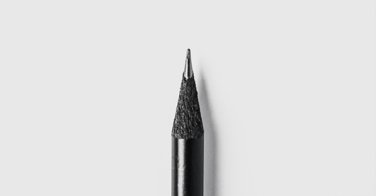 black pencil on white surface