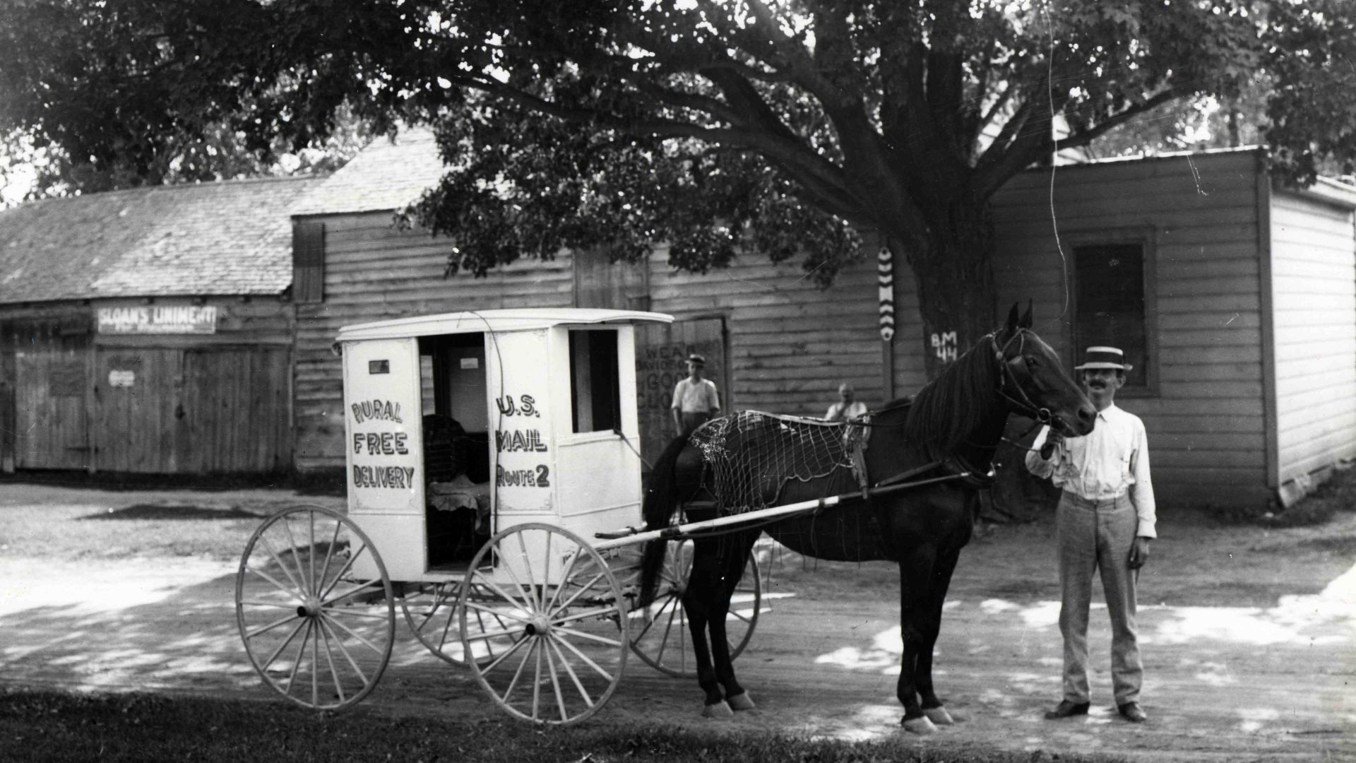 Description: Unidentified Rural Free Delivery carrier posed with his horse-drawn wagon. The wagon is labeled as servicing RFD Route #2. No information is available on the route's location.
Creator/Photographer: Unidentified photographer
Medium: Black and 