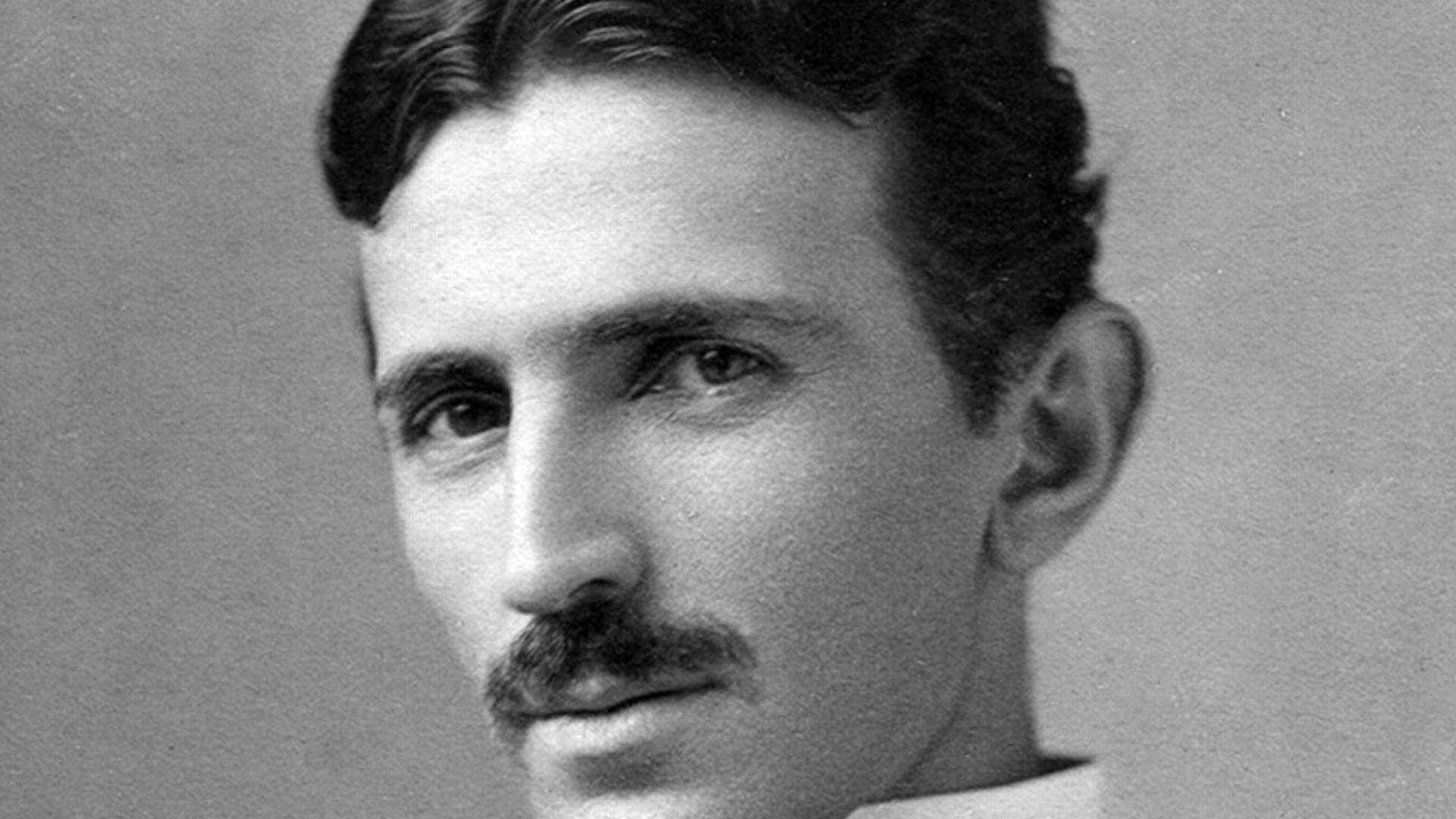 A photograph image of Nikola Tesla (1856-1943) at age 34.