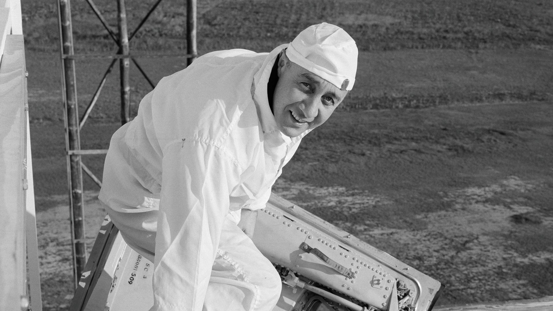 Astronaut Virgil I. Grissom, Gemini-Titan 3 command pilot, is shown entering the Gemini-3 spacecraft for a communications test at the Merritt Island launch area.