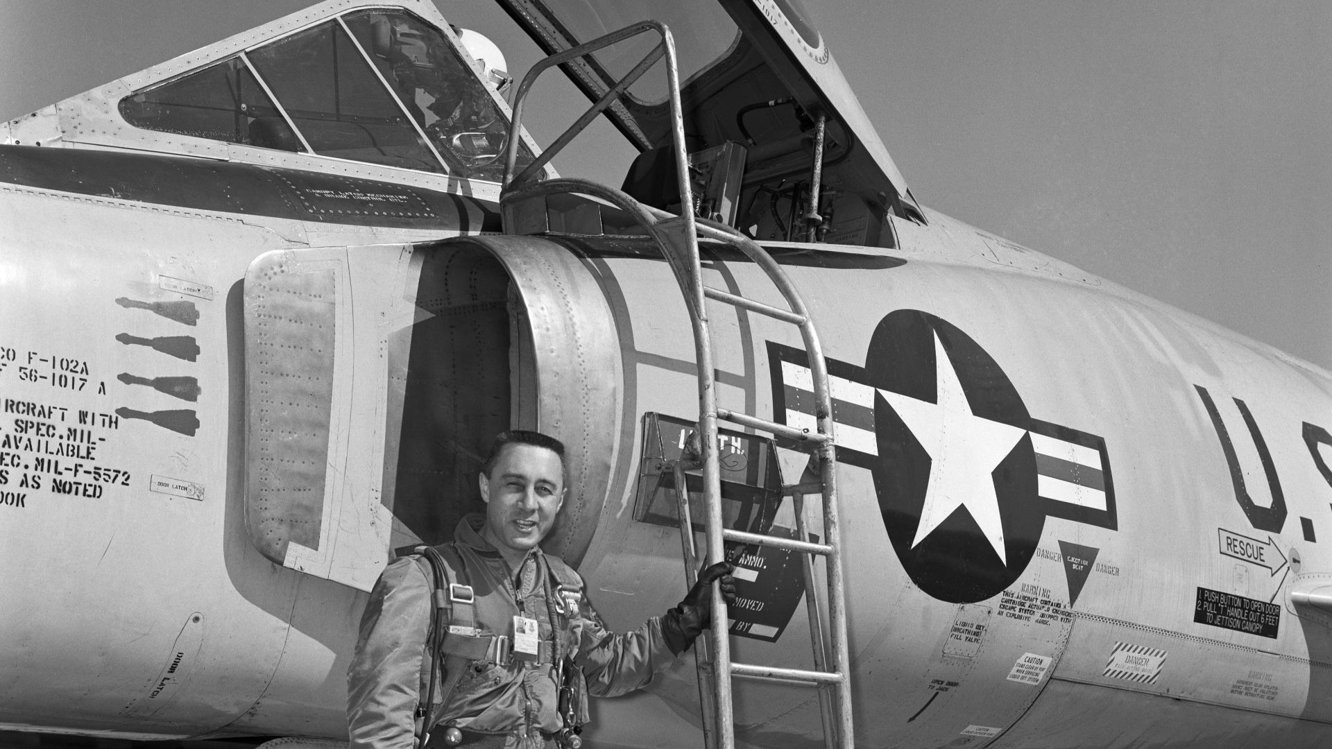 B60-00708 (1960) --- Astronaut Virgil I (Gus) Grissom pictured standing beside a F-102 on the flight line.